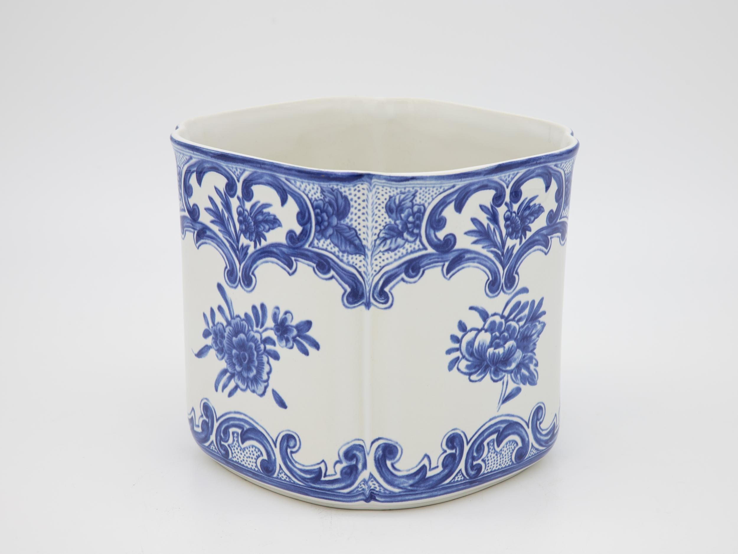 A blue and white Tiffany & Co cachepot in a square shape. Roses, flowers, and motif in the Delft style. This cachepot is stamped with the Tiffany & Co maker's mark and the year 1996.