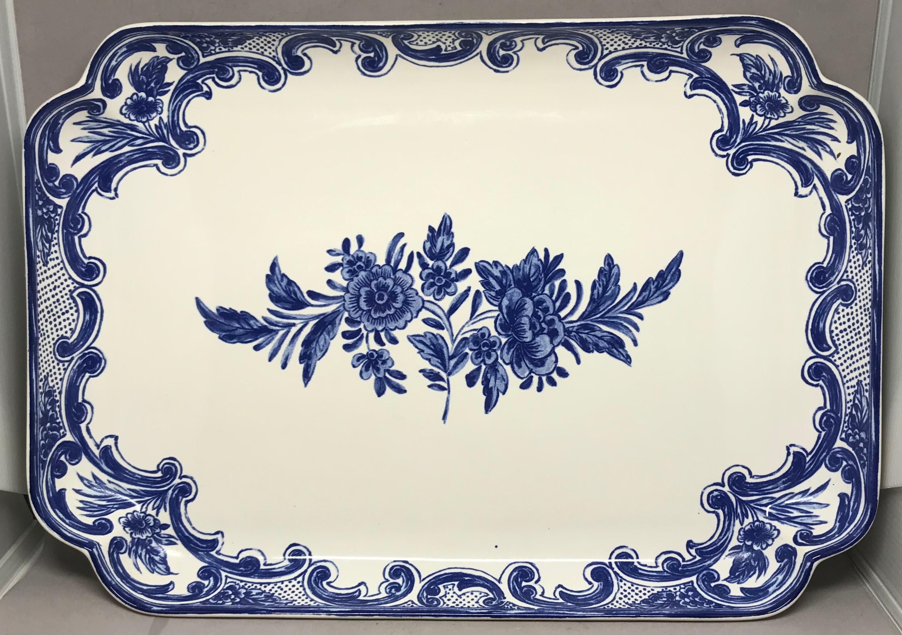Blue and white Delft Tiffany & Co. platter. Large shaped rimmed platter with floral reserve border centering a larger floral spray. Markings for Tiffany & Co. Portugal, 1994
Dimensions: 14.25” L x 10” W x 1.5” H.