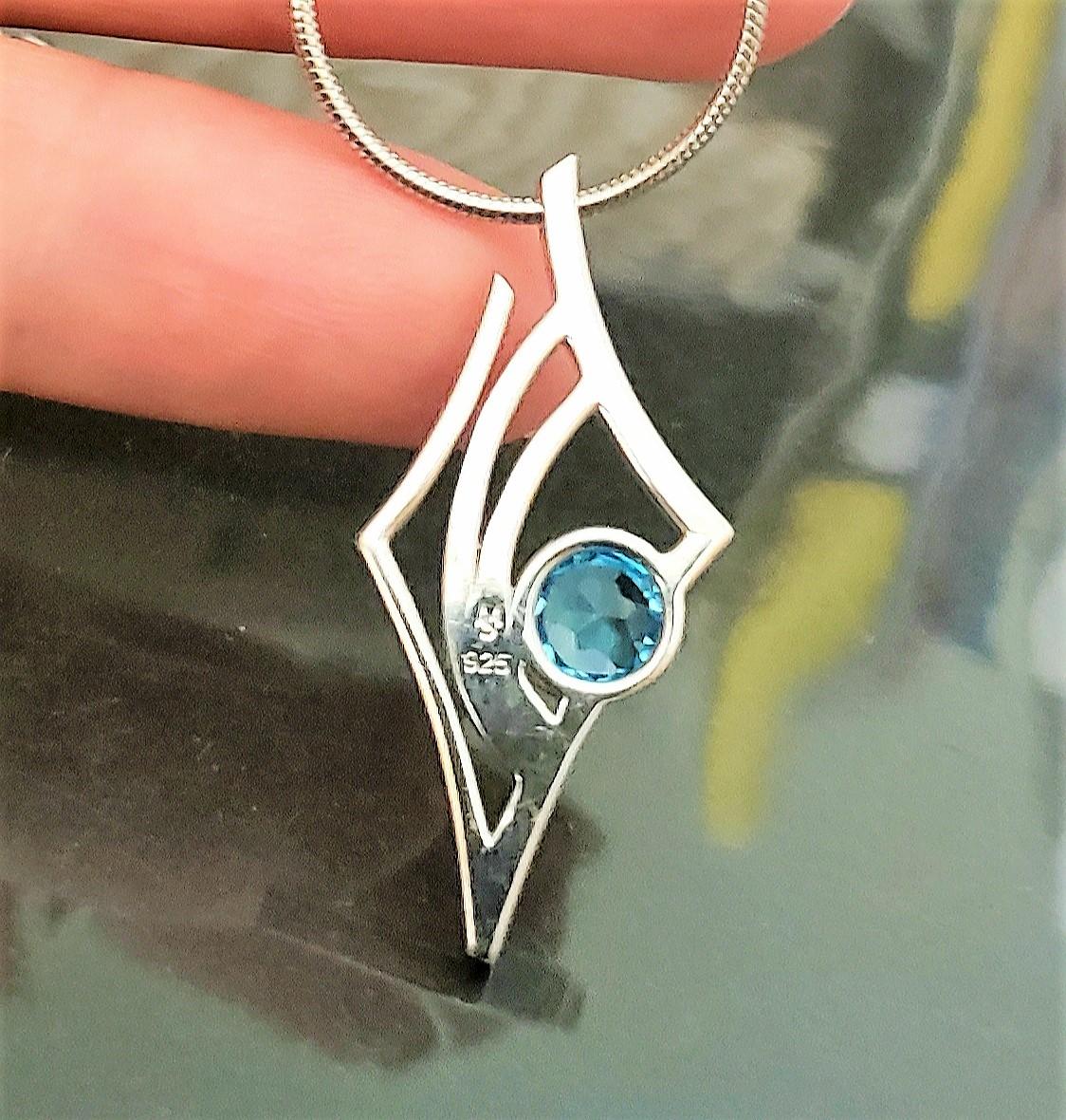 Contemporary Blue and White Topaz Antares Star Pendant in Sterling Silver For Sale