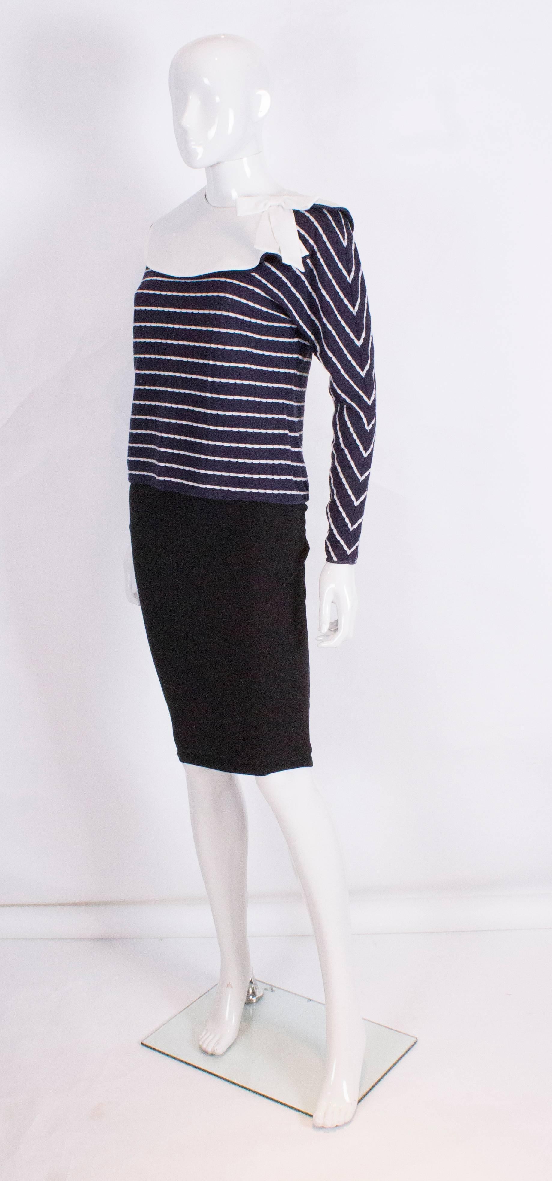 A chic blue and white top by Valentino with detachable white collar. The top is blue with white horizontal stripe and has a detachable blue and white detachable collar with a bow.