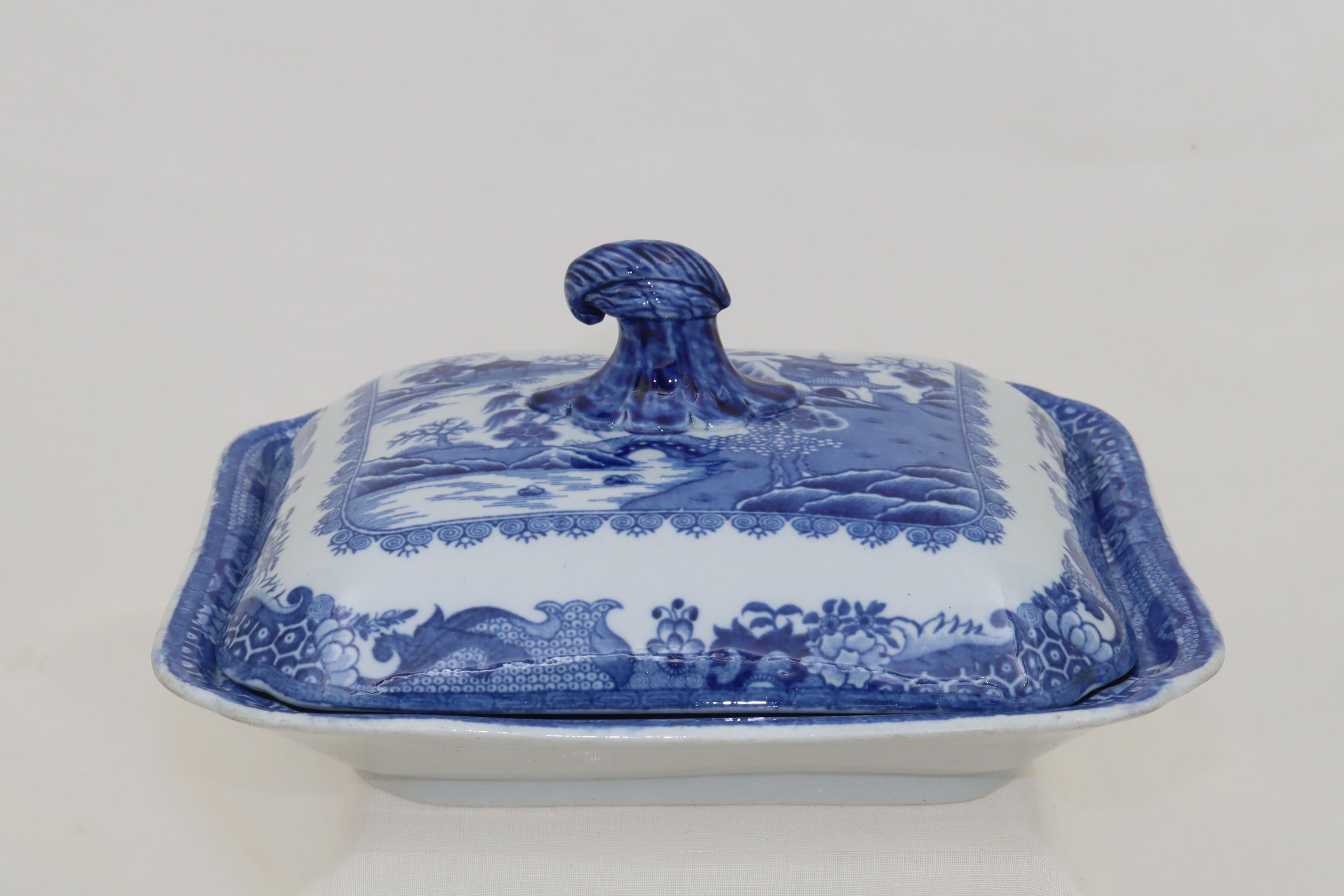 This lidded vegetable tureen by is by Turner & Co of Lane End in Staffordshire, who were in business from around 1762 until 1806. It is decorated with a printed blue and white willow pattern later known as 