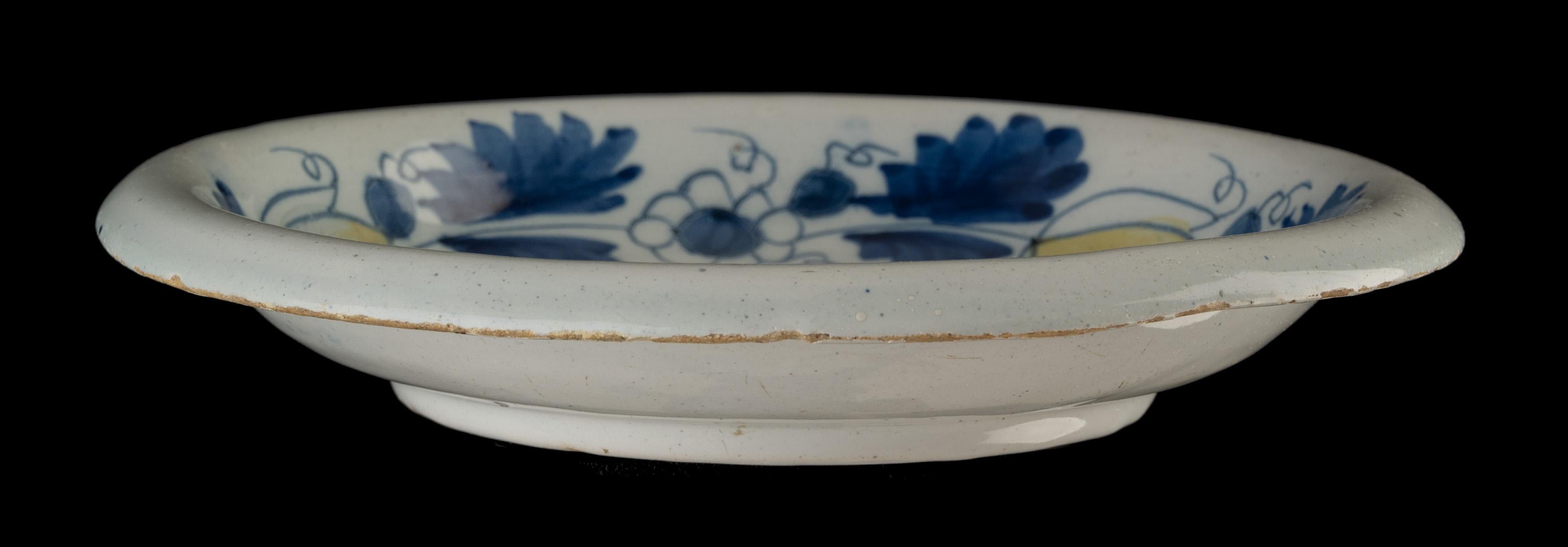 Glazed Blue and Yellow Bowl with Putto Delft, circa 1690 For Sale