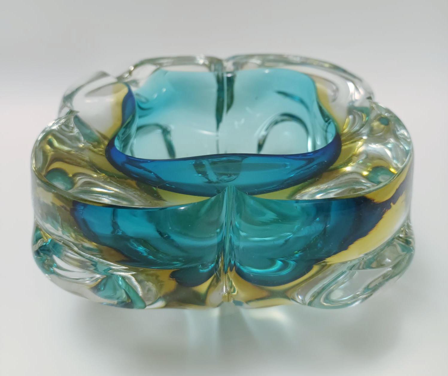 Vintage Italian blue and yellow Murano glass ashtray or bowl / Made in Italy, circa 1960s
Measures: diameter 5.5 inches, height 2.5 inches
1 in stock in Italy on 50% OFF SALE for $449 !
This piece makes for great and unique gift!
  