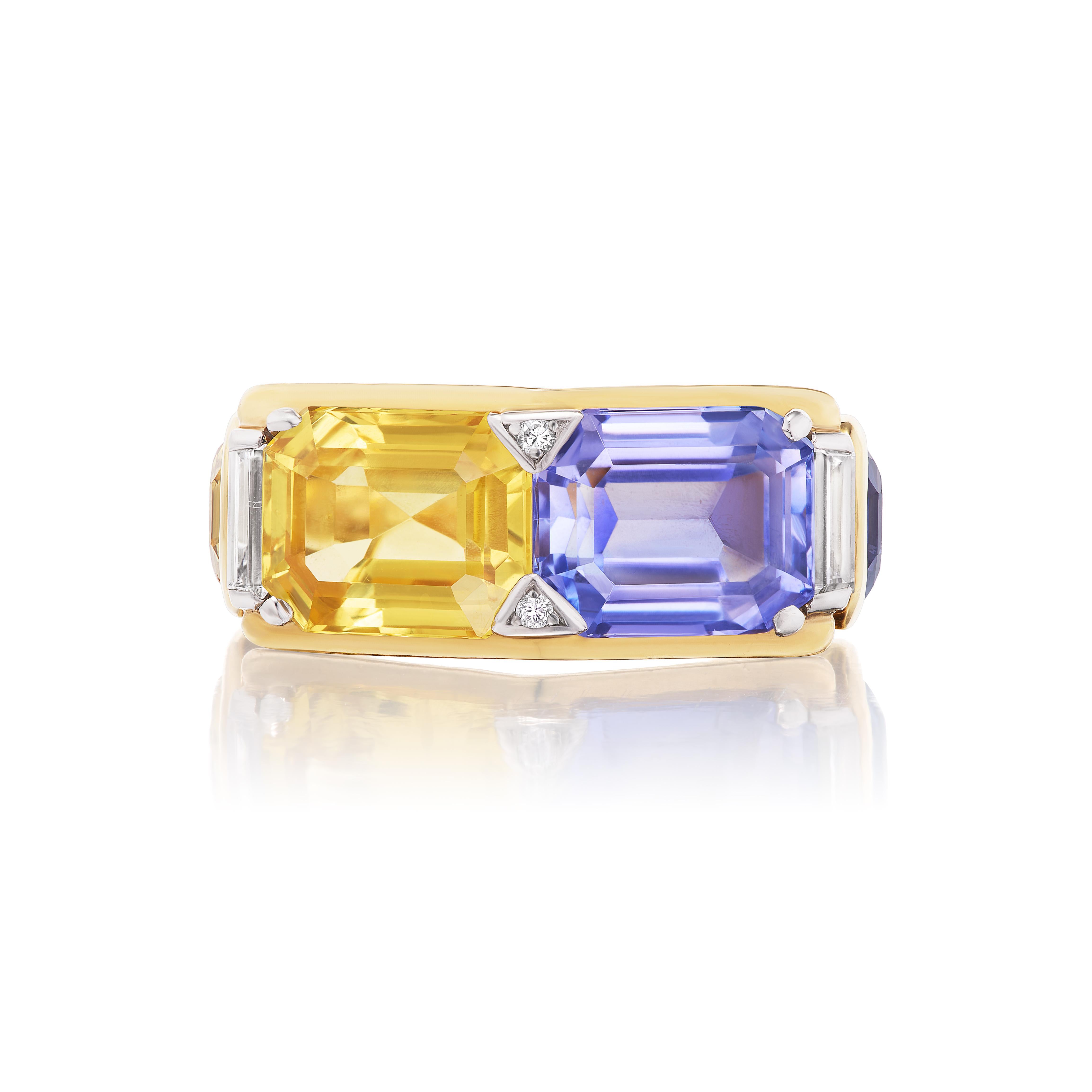 This lovely twin ring design features a yellow sapphire weighing approximately 4.67 carats and blue sapphire weighing approximately 5.41 carats. Both sapphires exhibit exceptional clarity and luster, and medium color saturation. The ring is further