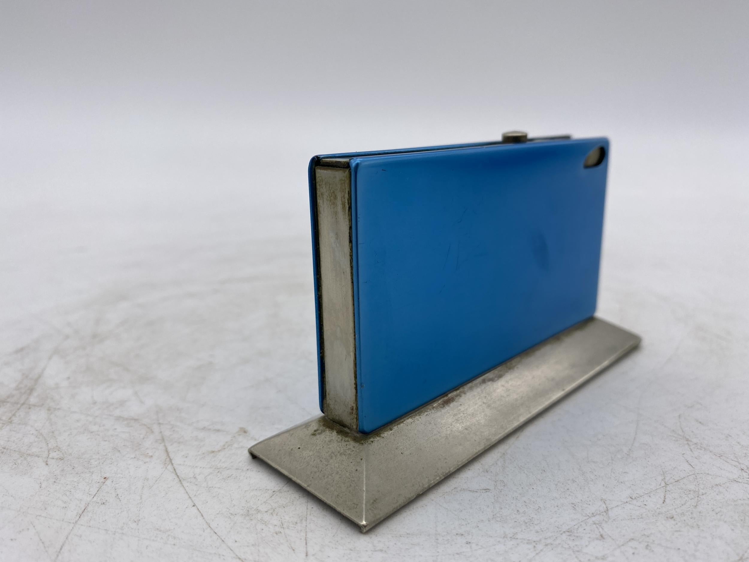 Original 1960s blue anodized aluminum table lighter with auto pop-button mechanism, made in Germany. Marked: 