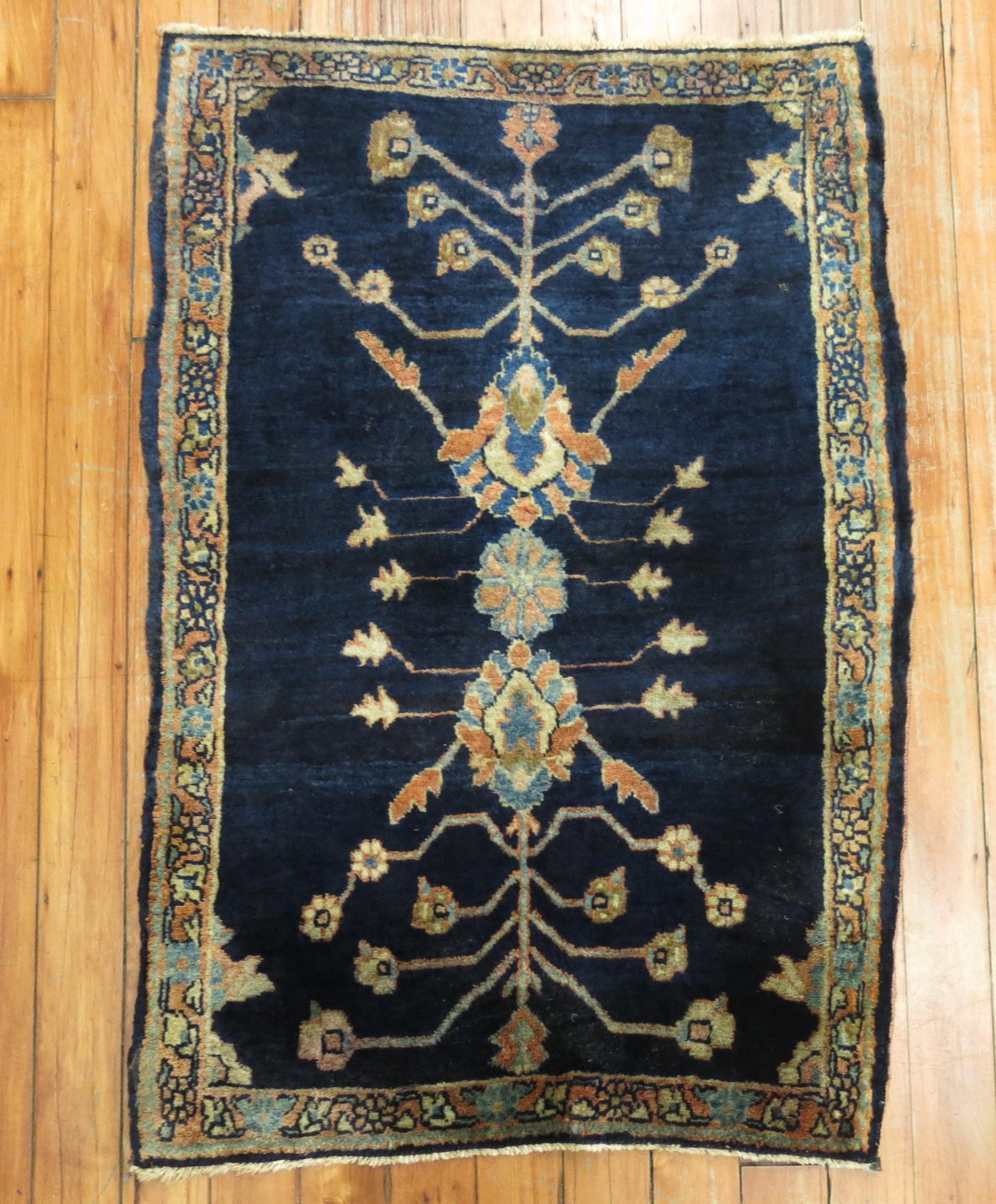 Stunning early 20th century Persian Sarouk Mohajeran rug mat.

Before the 1920s the Sarouk design was the most popular of Persian rugs worldwide. Most of them consist of deep red fields with navy borders. Rarely are they found in inverse colors