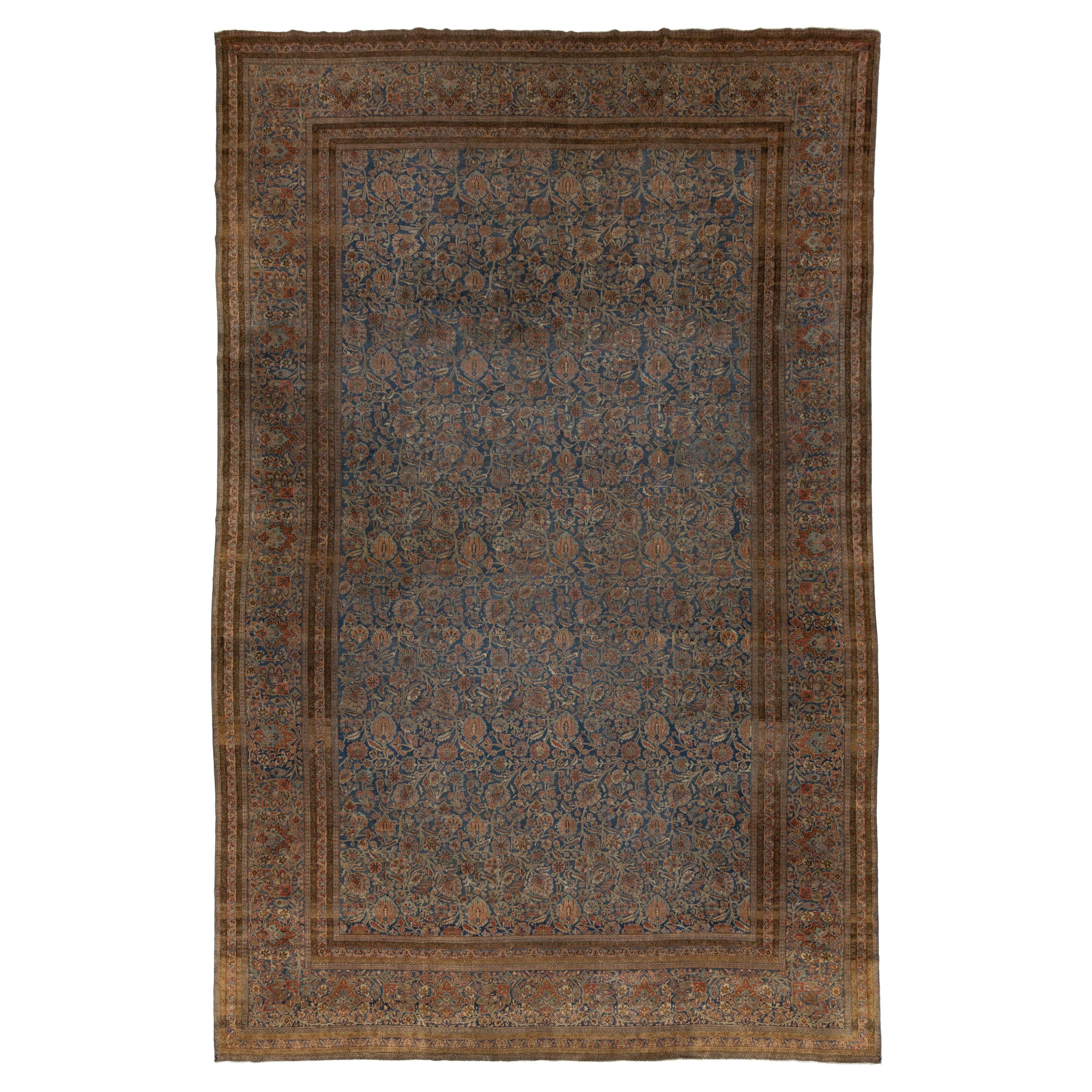Tapis persan ancien en laine de Kashan bleu, fabriqué à la main avec un motif floral