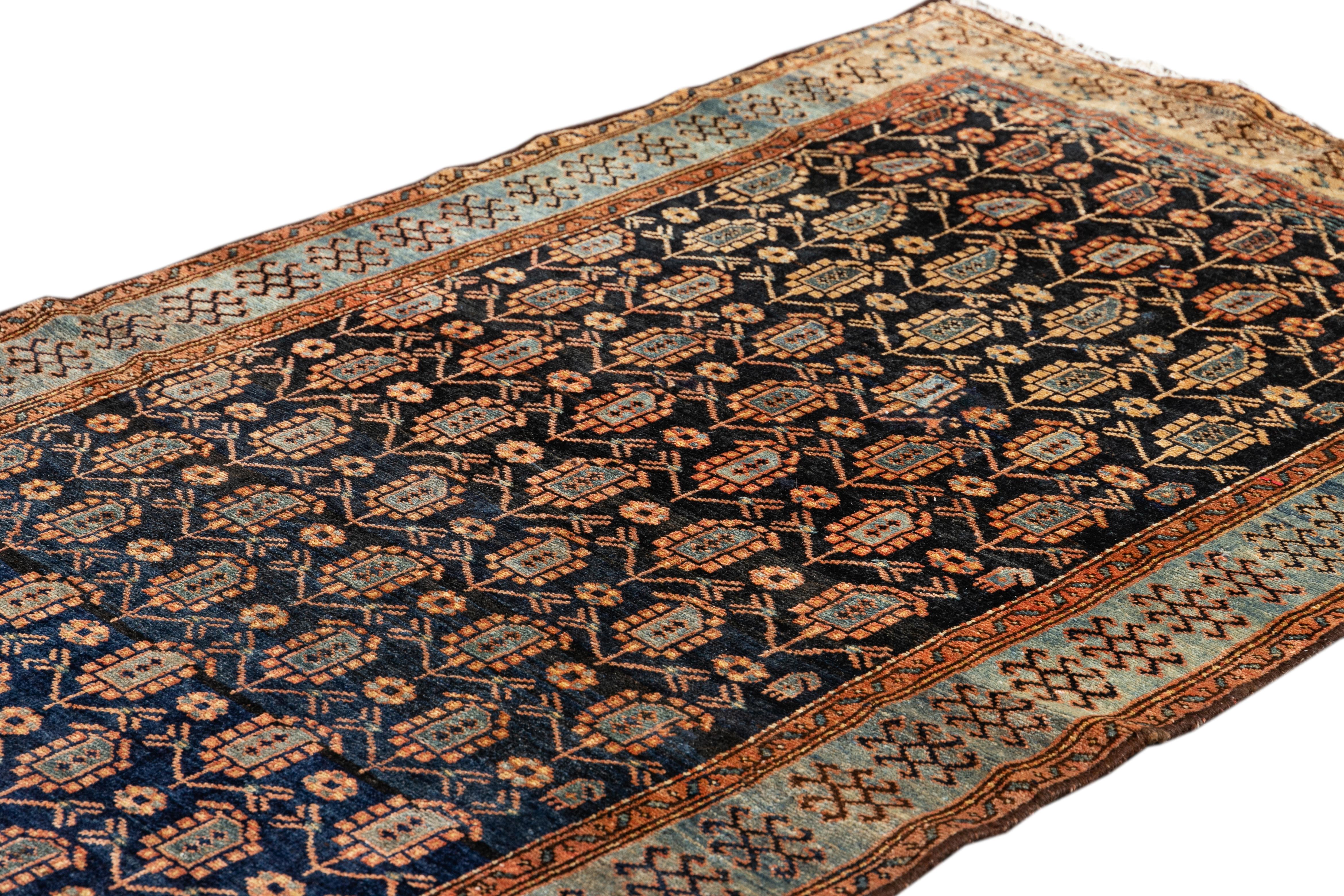 Beautiful antique Malayer Persian runner rug with a dark blue field. This piece has gray and rust accents with an all-over geometric floral design. 

This rug measures: 3'8