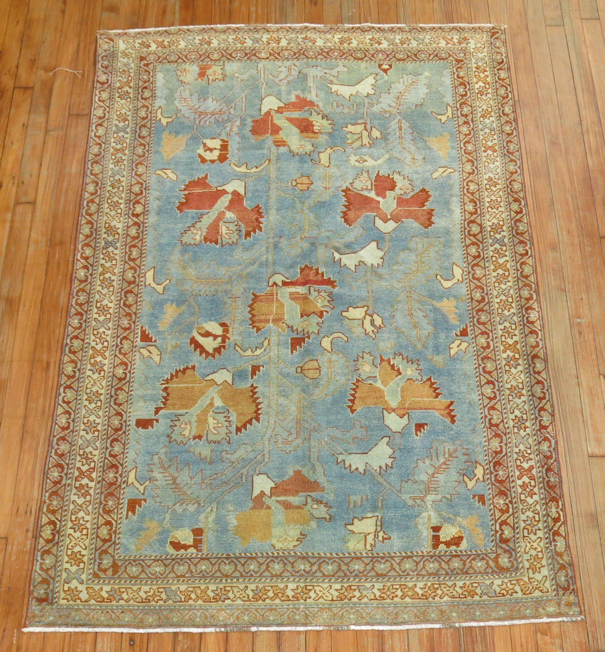 An early 20th century Persian Malayer with a Primitive all-over leaf design on a watery blue field.

4' x 6'5''