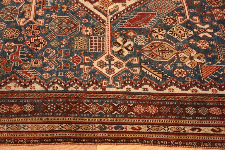 Blue Background Antique Persian Qashqai Rug, Country of origin / rug type: Persian Rug, Circa date: 1910. Size: 4 ft 10 in x 7 ft 2 in (1.47 m x 2.18 m)


