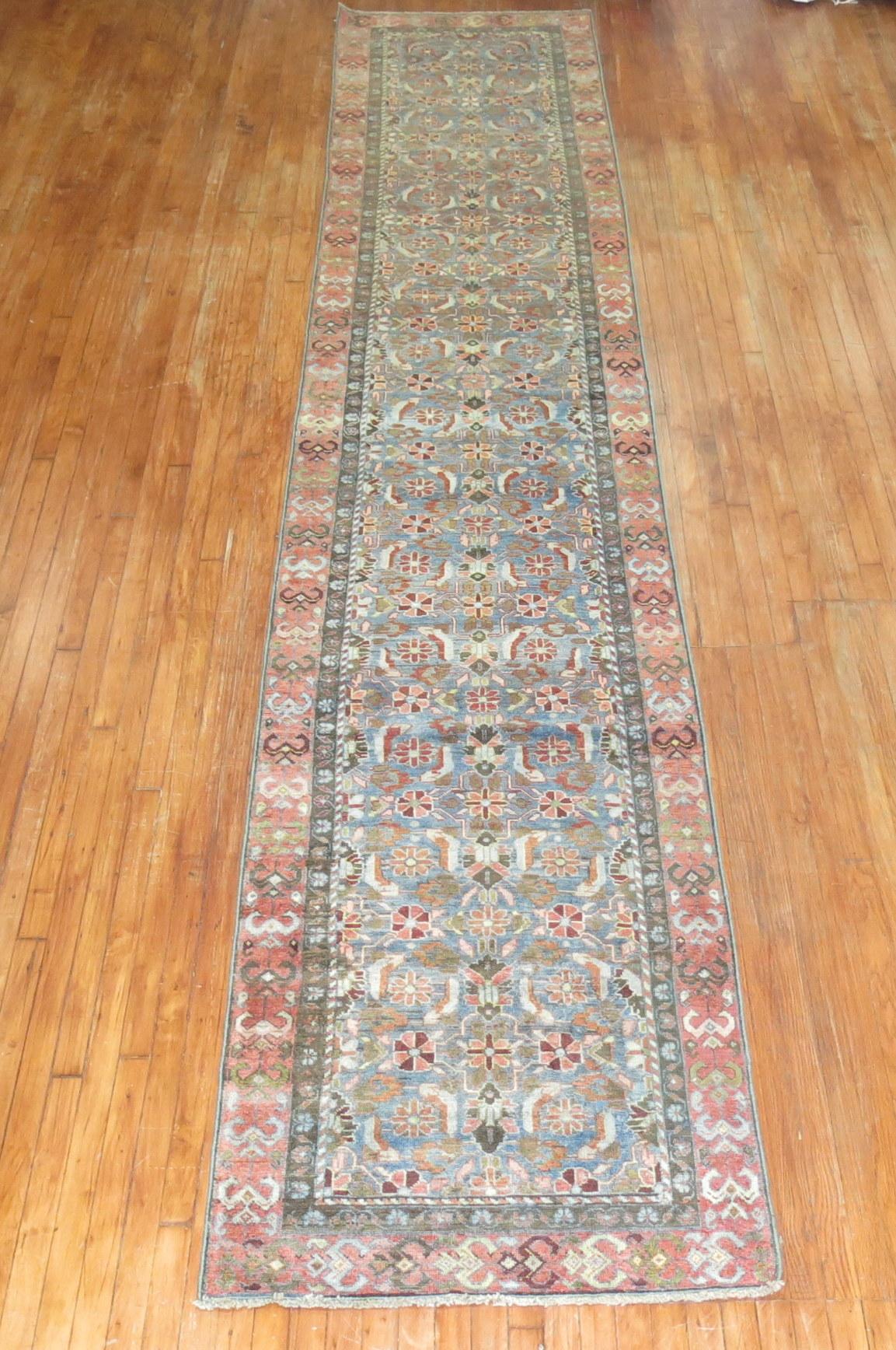 Persian Malayer runner from the early 20th century. Blue field accents in terracotta, green-gray and brown

Measures: 3'1