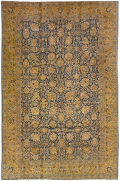Tapis persan ancien en laine bleu de Tabriz, fait à la main, à motifs floraux surdimensionnés