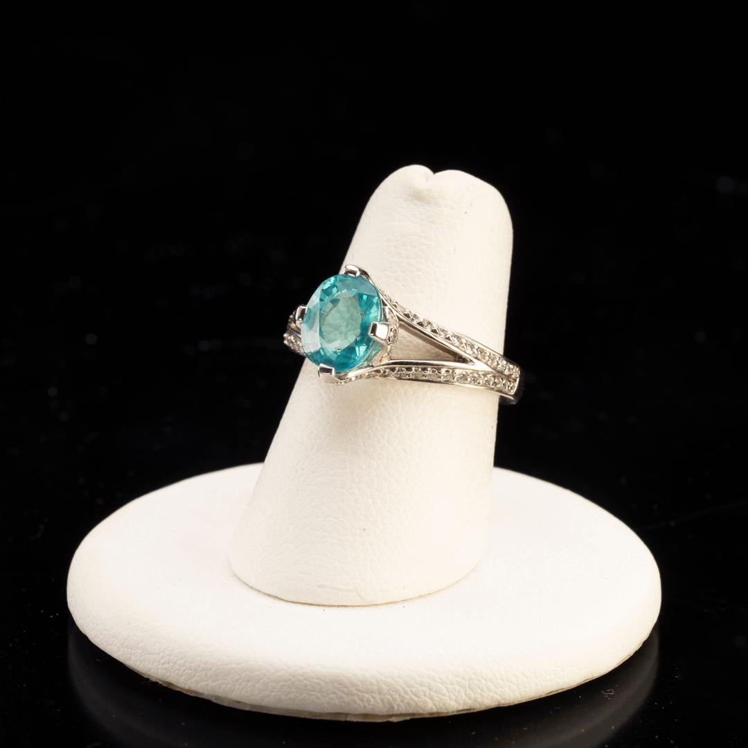 This delicate confection features a sparkling blue apatite stone set in 14K white gold surrounded by a dazzling arrangement of white diamonds. An elegant and modern ring that provides the perfect amount of flash and color for everyday as well as for