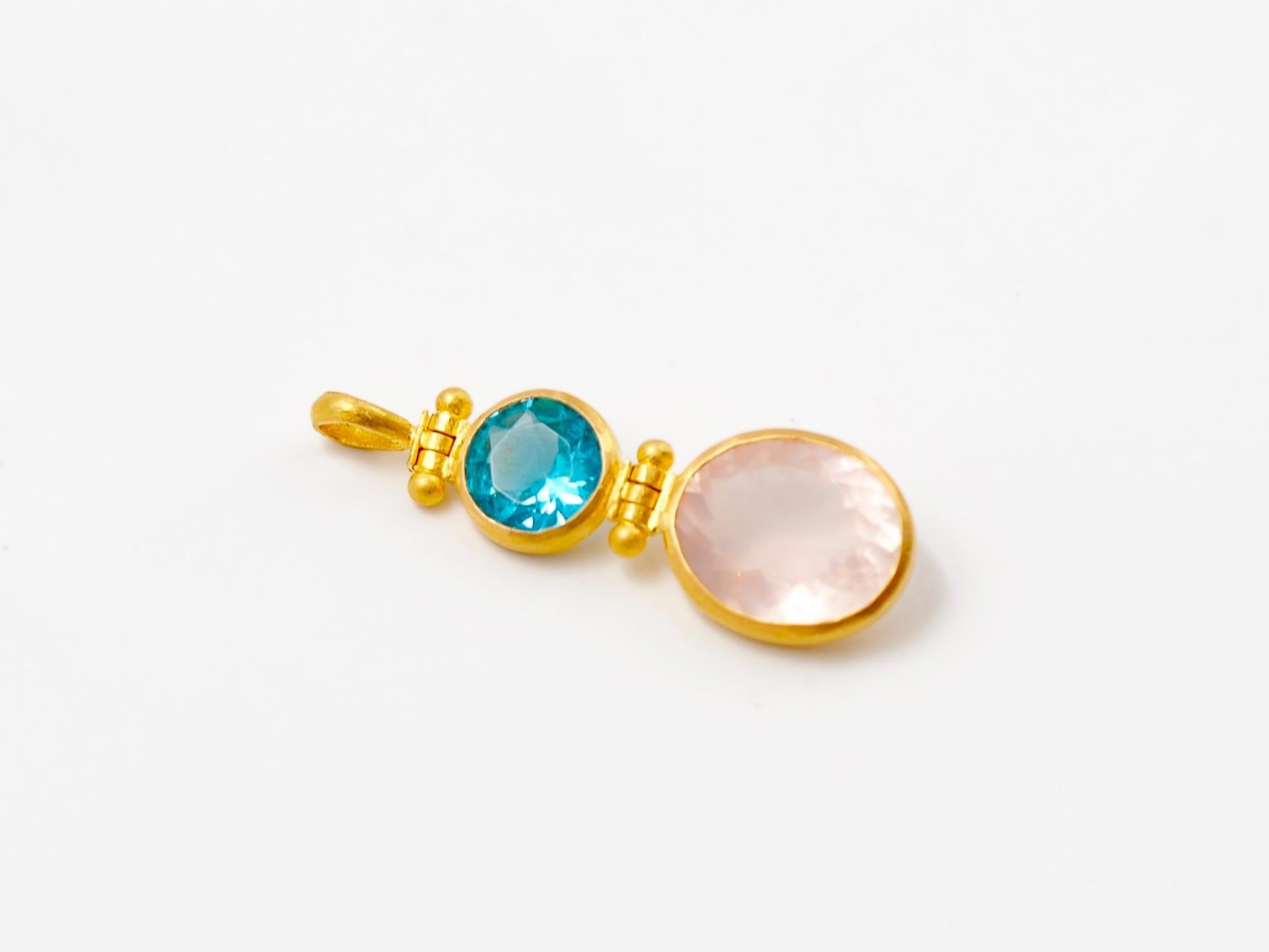 This pendant is composed of a blue apatite of 1.29 cts and a rose quartz of 3.23 cts. 
Between the stones and at the top part, the pendant has 2 swivels mechanisms to allow good movement and good light into the stones. 

This double pendant exists