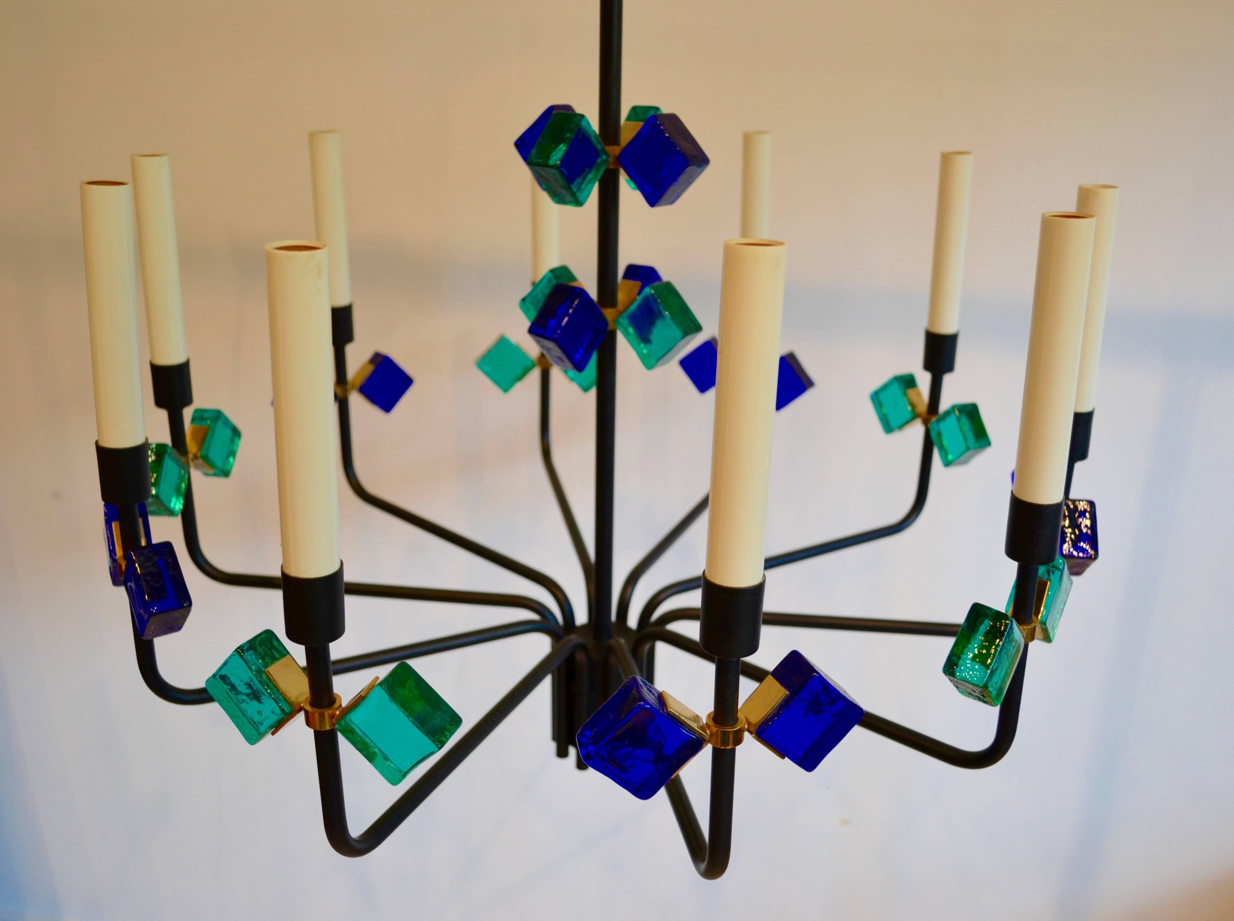 Rare and exceptional Danish chandelier by Svend Aage Holm Sorensen for Holm Sorensen and Company, Denmark, 1950. Gorgeous cobalt blue and aqua glass with brass detail and matte black metal frame. Ten lights.