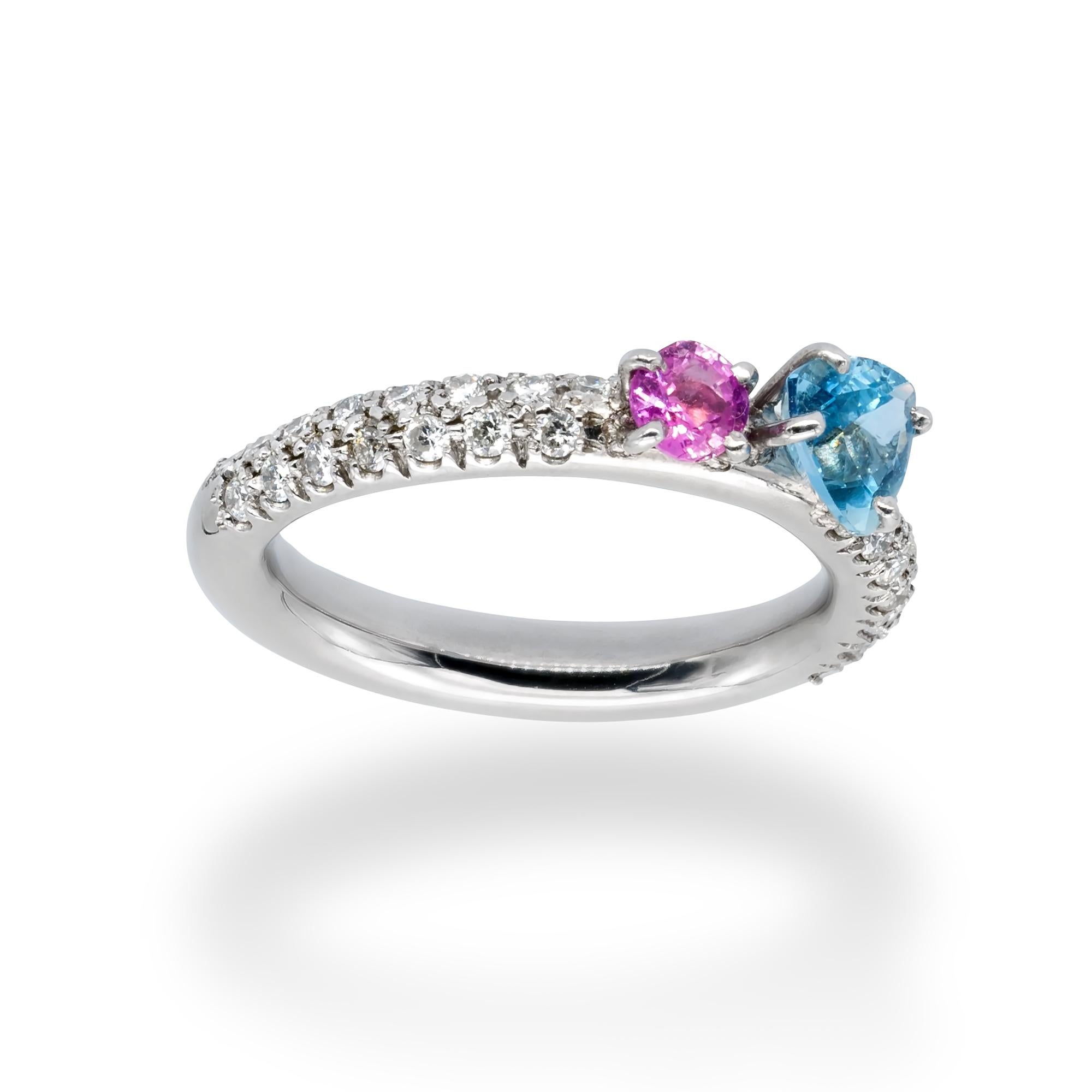 d'Avossa Rainbow Collection’s Ring, 18Kt white gold with a pavé of 0.45 cts white diamonds, 0.60 cts trillon Blue Aquamarine and 0.42 cts Pink Sapphire.
This Ring has been designed to be worn alone, or together with one or more rings from the same