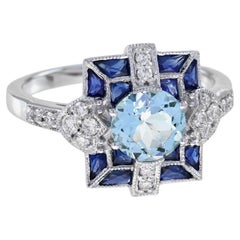 Bague en or blanc de style Art déco avec aigue-marine bleue, saphir et diamant