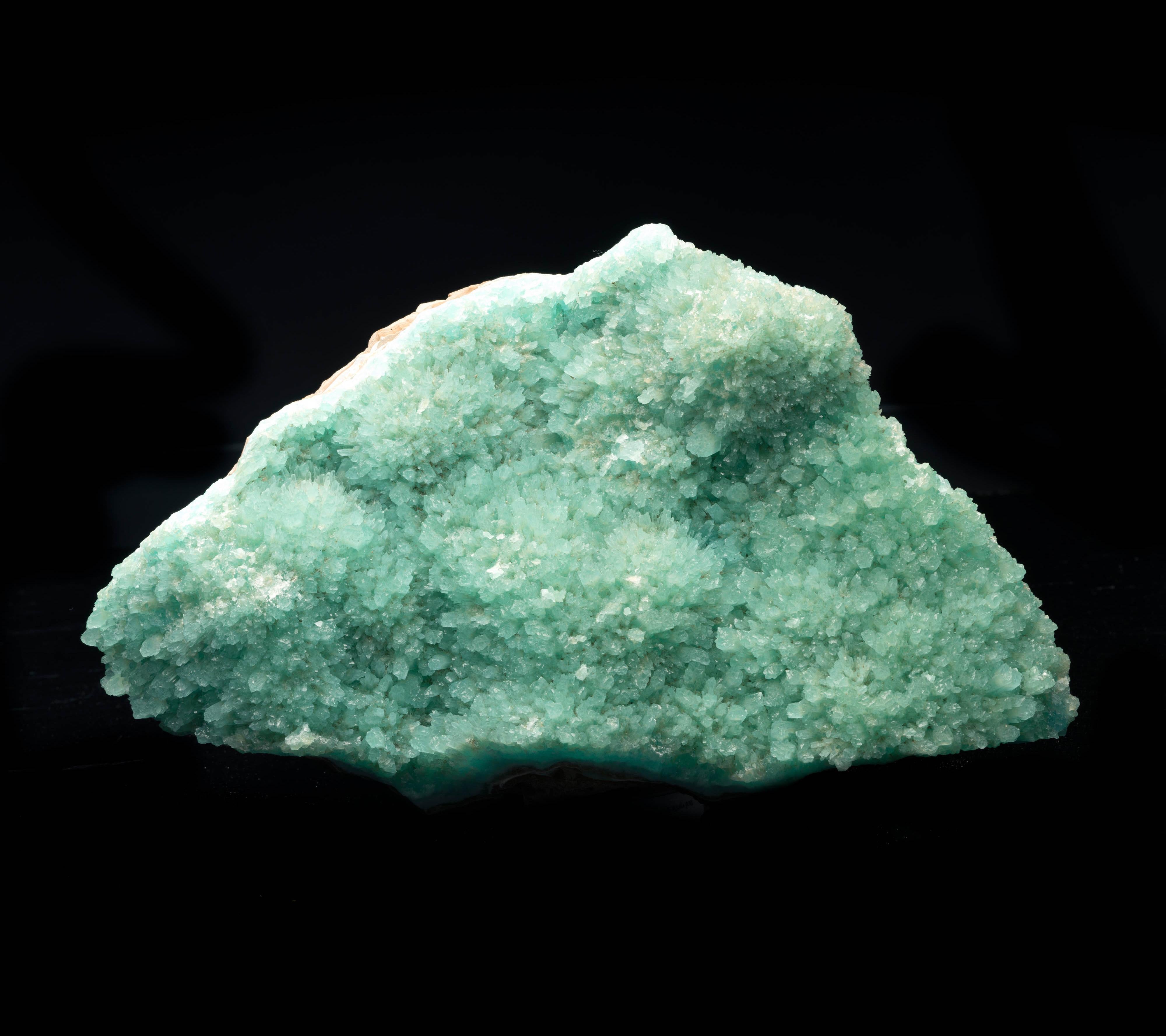 The crystallized blue form of the calcium carbonate mineral aragonite is very sought-after. This substantial piece features gorgeous teal blue color and great luster and crystallization. This specimen comes from a pocket recently discovered in