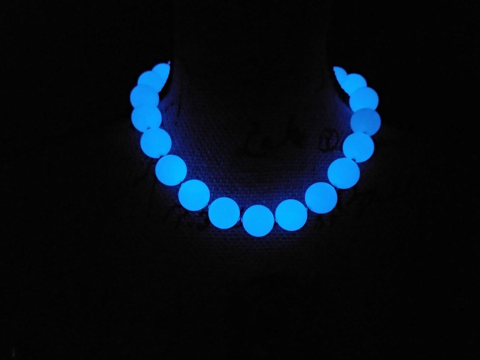 The length of the necklace is 18 inches (45 cm). The size of the smooth round beads is 16 mm. Beads are a very soft blue color.
Aragonite possesses natural phosphorescence, causing it to emit a captivating blue glow in the darkness.

Aragonite is a