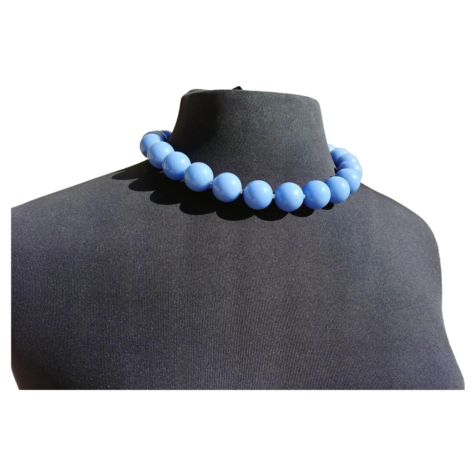 The length of the necklace is 18 inches (45 cm). The size of the smooth round beads is 16 mm.
Beads are a very soft blue color. 
Aragonite is a carbonate mineral, one of the three most common naturally occurring crystal forms of calcium carbonate.