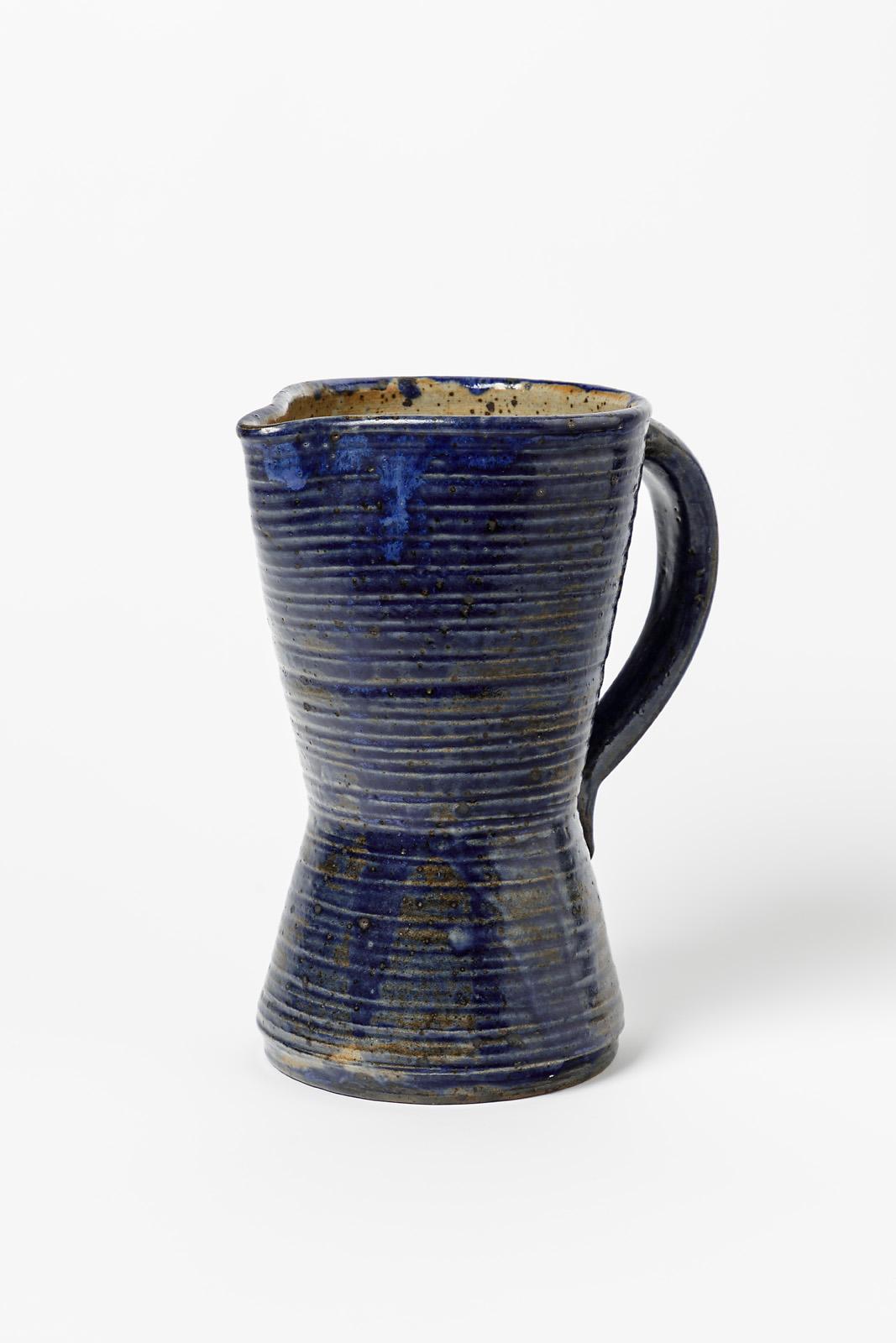 Marius Bernon

Art deco stoneware ceramic pitcher realised in la Borne

Circa 1940

Blue stoneware ceramic glaze colors

Signed under the base

Original perfect condition

Height 23 cm
Large 20 cm