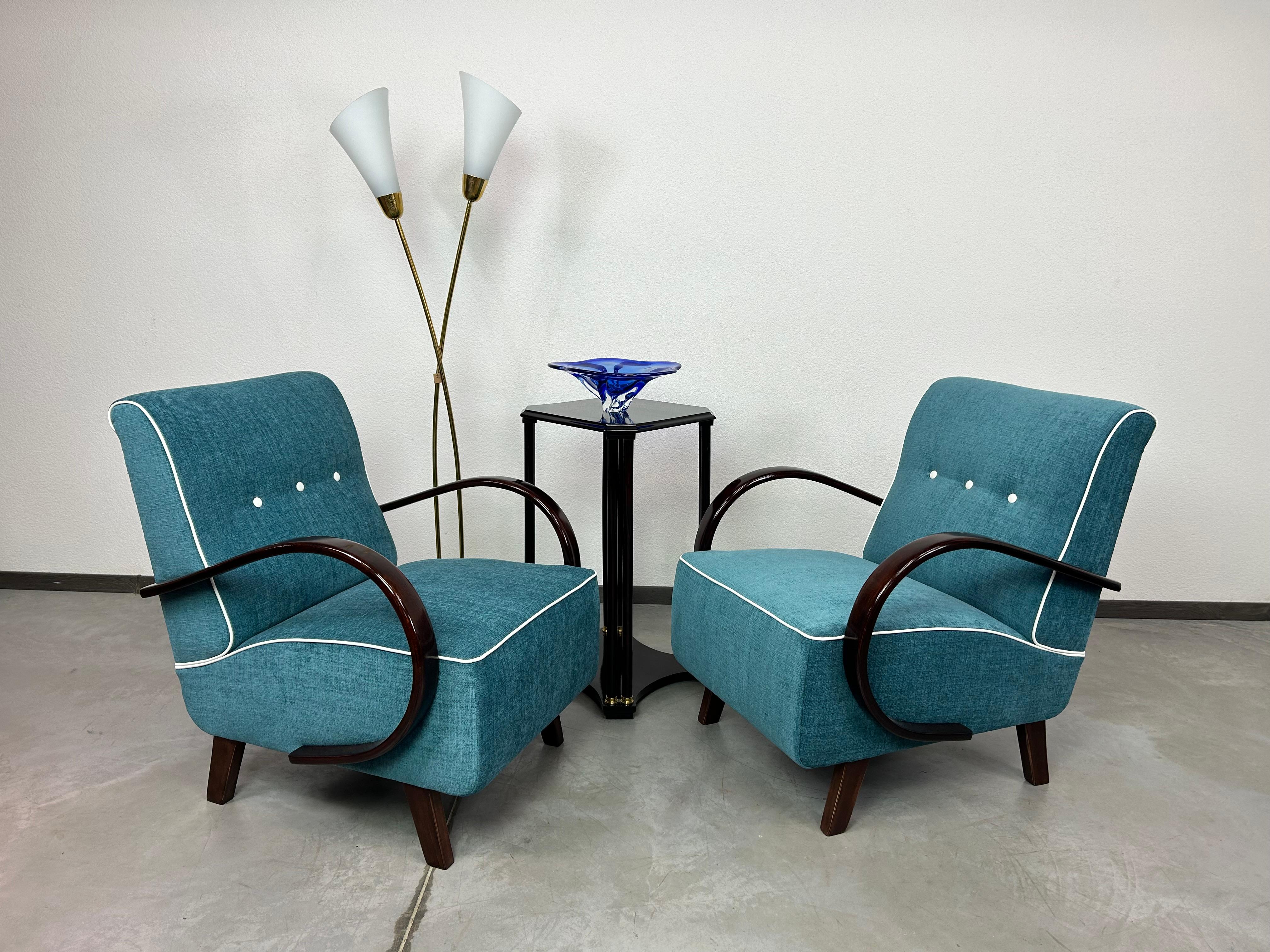 Blue art deco armchairs by Jindřich Halabala designed in 1930s when Halabala was leading designer for UP Závody Brno. Professionally stained and repolished with new fabric.