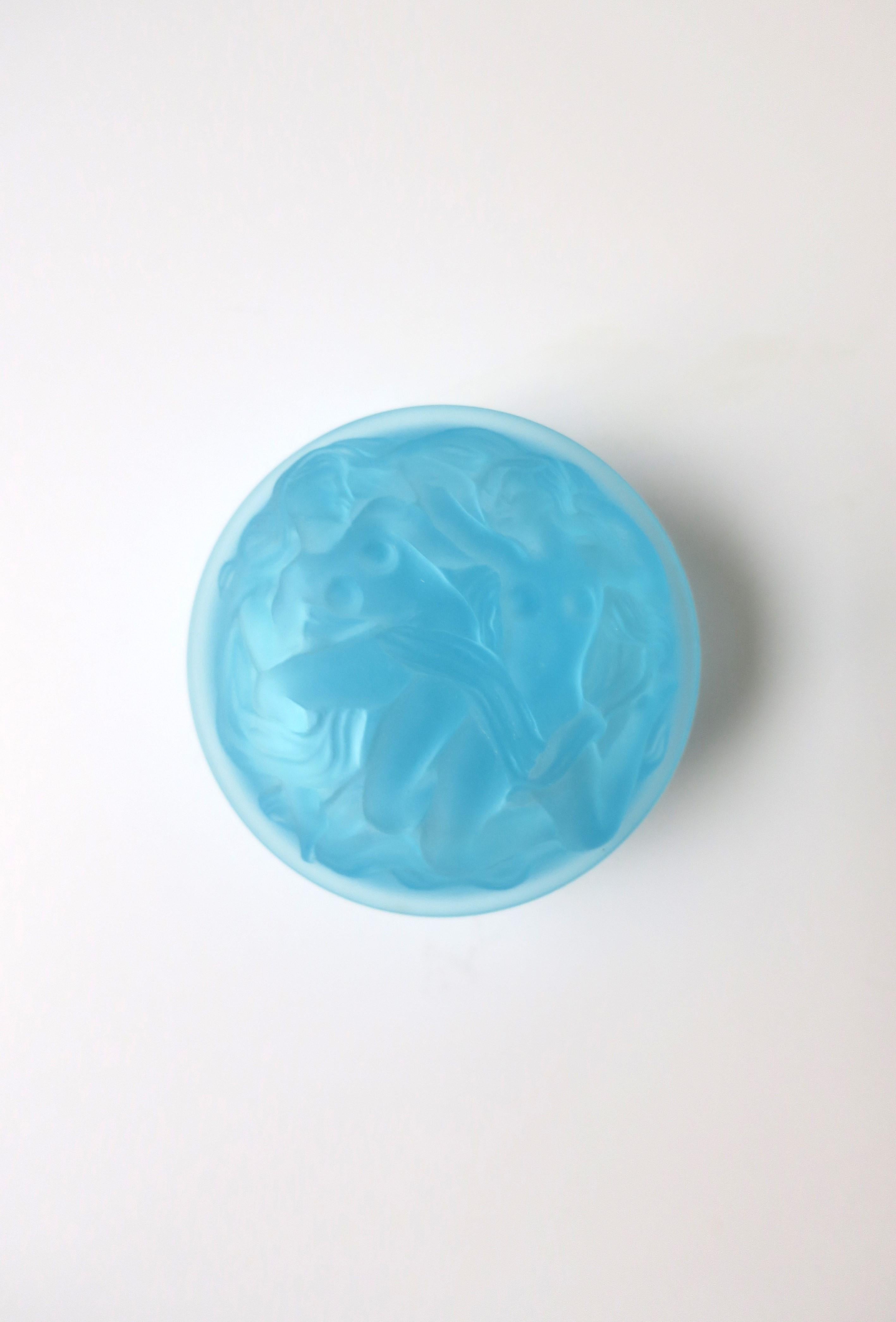 A beautiful sky-blue translucent Bohemian glass box with female relief in the Art Deco style, circa late-20th century, Czech Republic. This round box has a high relief of females on box lid and base circumference. A beautiful box to hold small items
