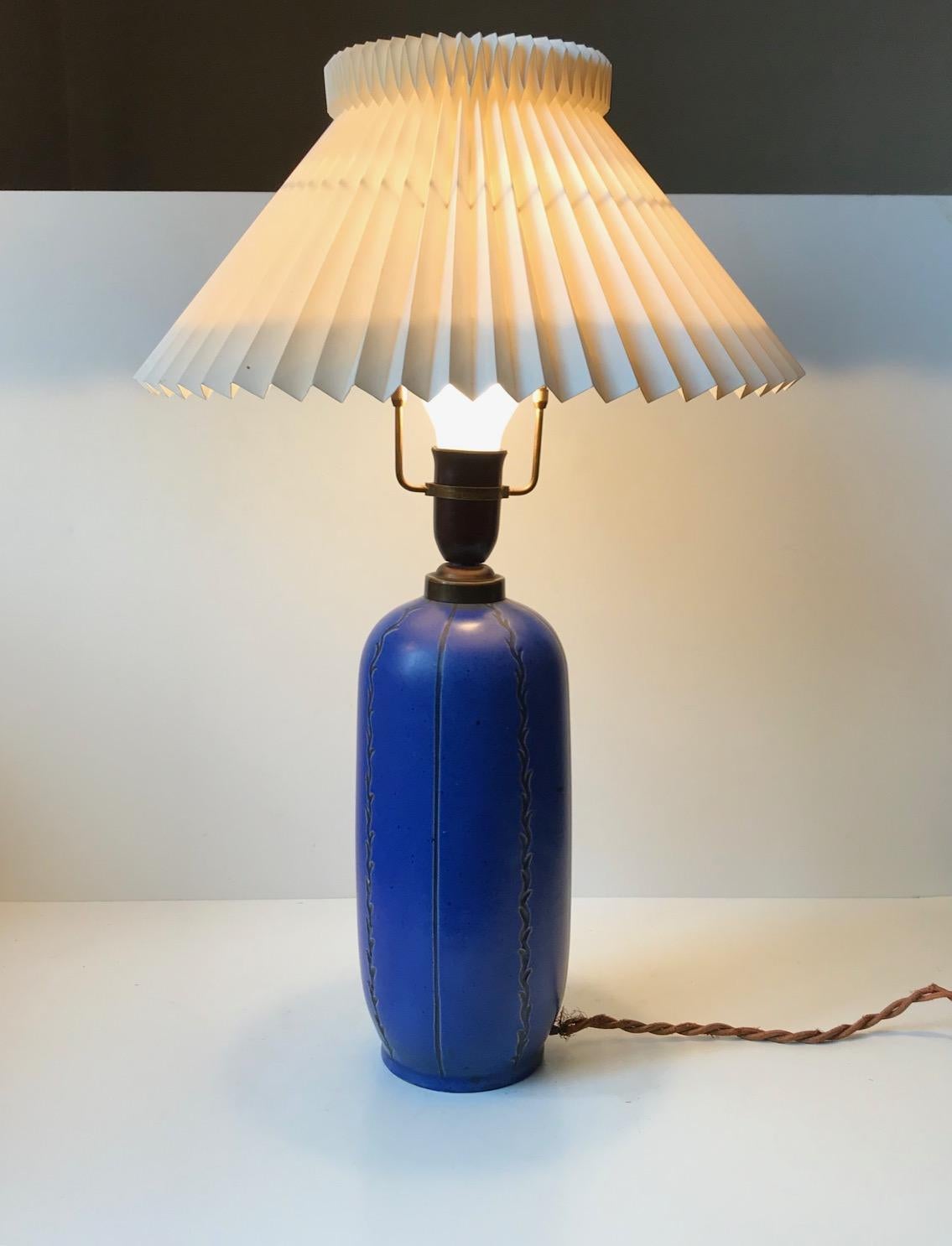 Perfectly shaped ceramic table lamp by Søholm, Denmark. It has a vibrant blue glaze and is decorated with stripes and stylised branches. This light comes without a shade so please personalize with your own pick.