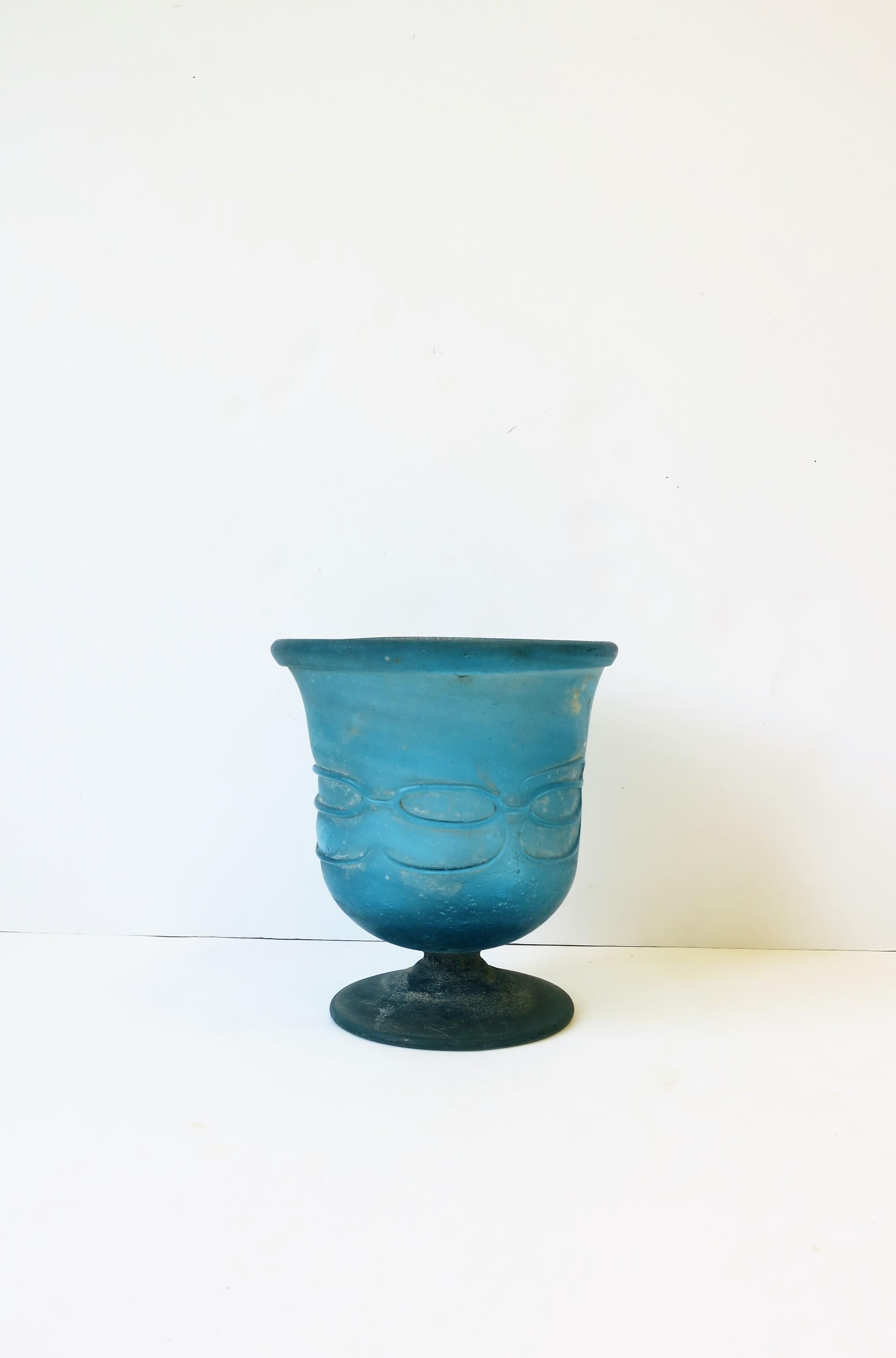 A beautiful Post-Modern Italian blue blown glass art glass urn vase with loop exterior design, controlled bubble interior and a 'scavo' rustic matte weathered finish/surface, circa late-20th century, Italy. In the style of Seguso. Beautiful as a
