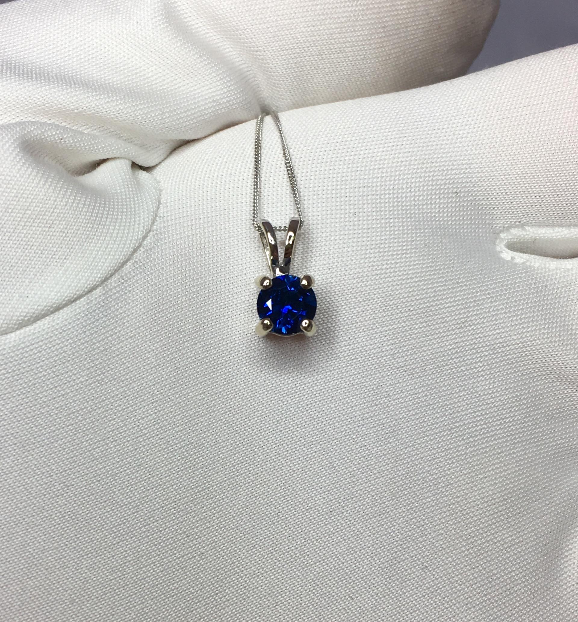 Beautiful natural 0.75 carat blue Sapphire set in a fine 18k white gold solitaire pendant.

Stunning blue sapphire with fine deep blue colour and excellent clarity. Very clean.

It also has an excellent round cut which shows lots of brightness and