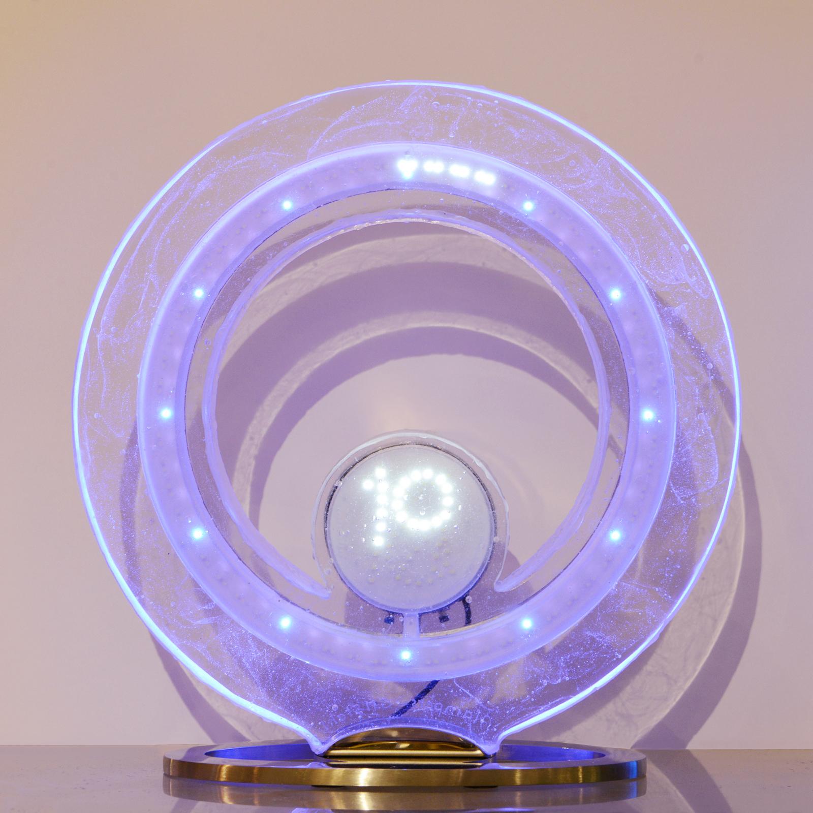 Clock with blue number in crystal made with pure crystal
glass sanded paste with led diodes inside. With color change
system. With number indicated in crystal ring with led diodes.
Base in polished stainless steel mirror finish. Measures:
Base L