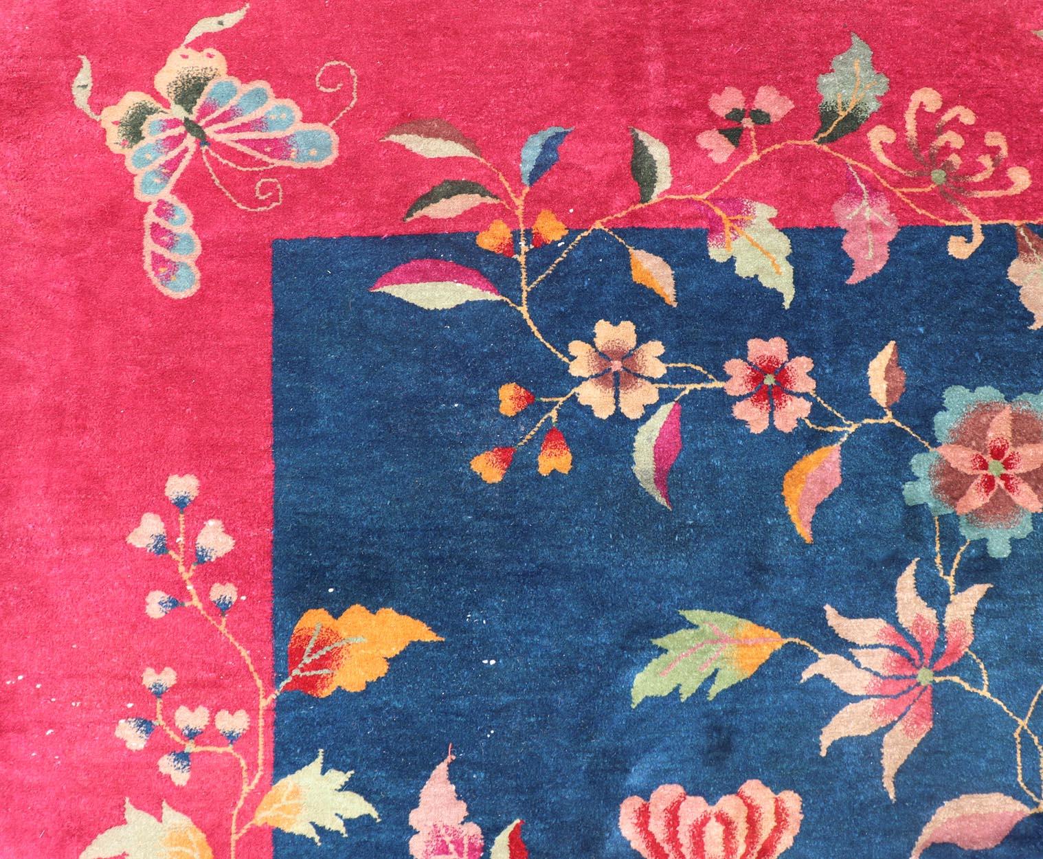 Blue Background Chinese Art Deco Rug with Large Vining Flowers and Leaves. Keivan Woven Arts / rug X23-0603, country of origin / type: China / Art Deco, circa 1920.
Measures: 9'0 x 11'4 
Alive with color, this beautiful antique Art Deco Chinese rug
