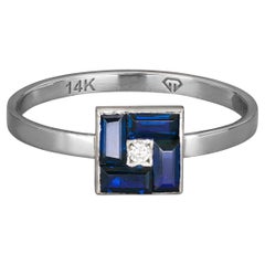Anello con baguette blu in oro 14k