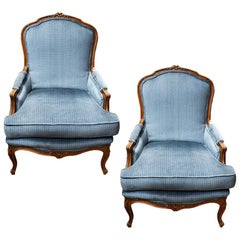 Vintage Blue Bergère Louis XV Style Armchairs with Carved Wood Accents, a Pair
