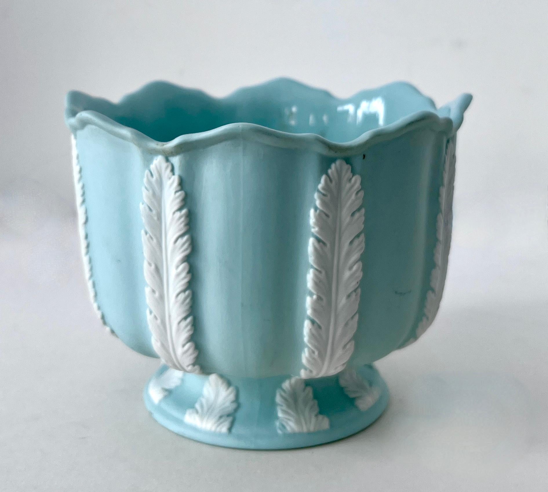 A unique vintage piece with graphic white leaves and smooth satin bisque or ceramic Tiffany blue field.

This is a wonderfully decorative piece - while you could use it for candy, mail, or office supplies, it also would make a terrific planter for