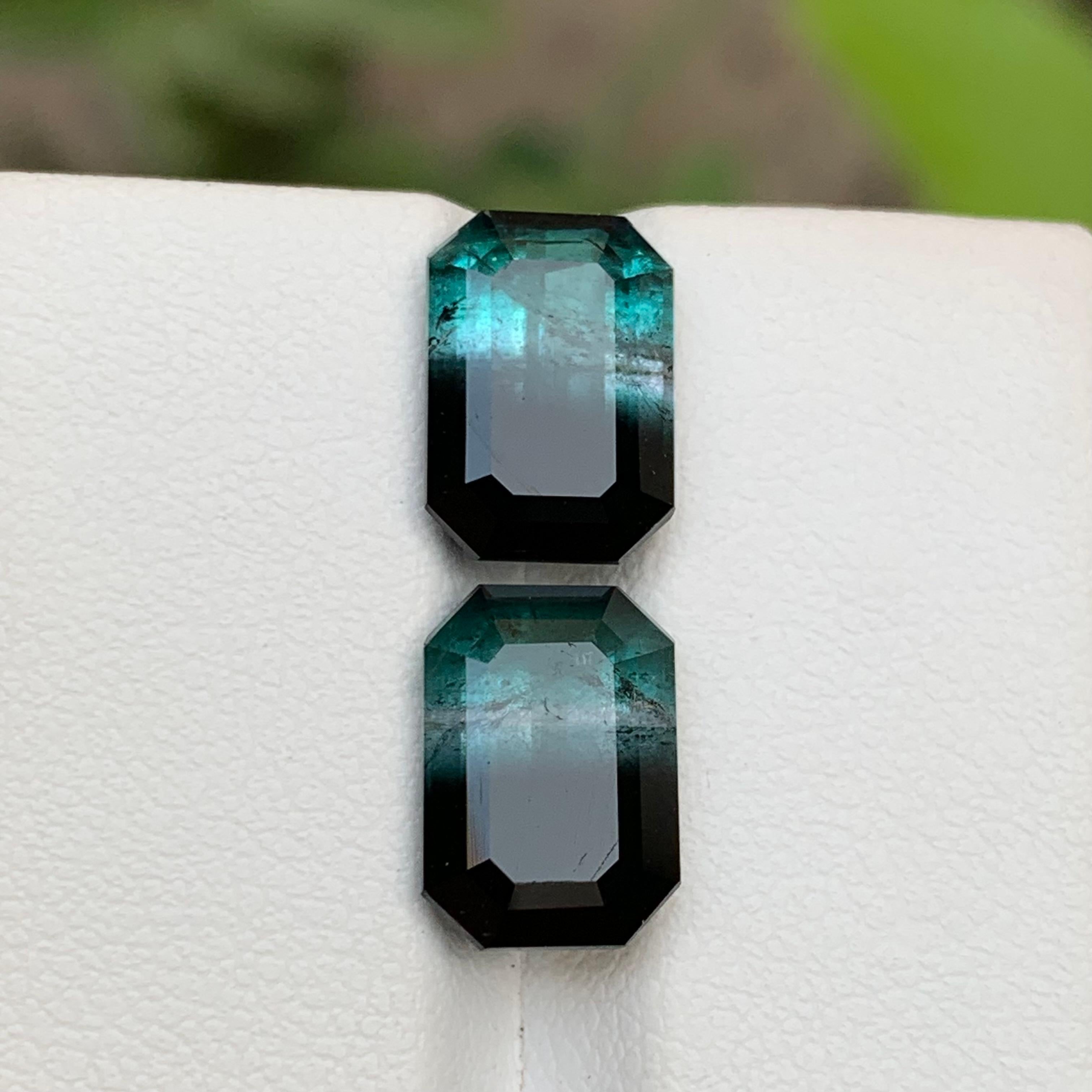 Neon Blue and Black Bicolor Natural Tourmaline Loose Gemstones Pairs from Kunar, Afghanistan!!

💎 GEMSTONE TYPE: Tourmaline 
⚖️ WEIGHT: 8.85 Carats
🪚 SHAPE & CUT: Emerald Cut
📏 SIZE (MM): 
4.40 Ct (10.91 x 7.69 x 5.87
4.45 Ct (10.93 x 7.72 x