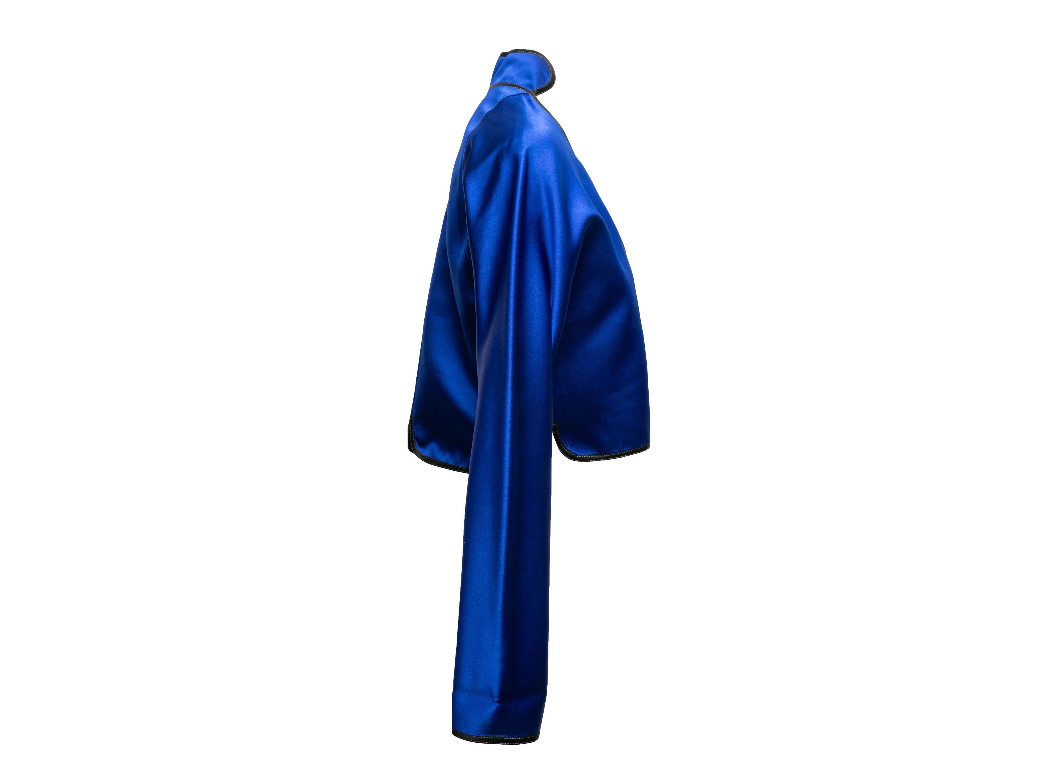 Blue and black silk cropped jacket by Geoffrey Beene. V-neck. Mask motif button closures at front. 38