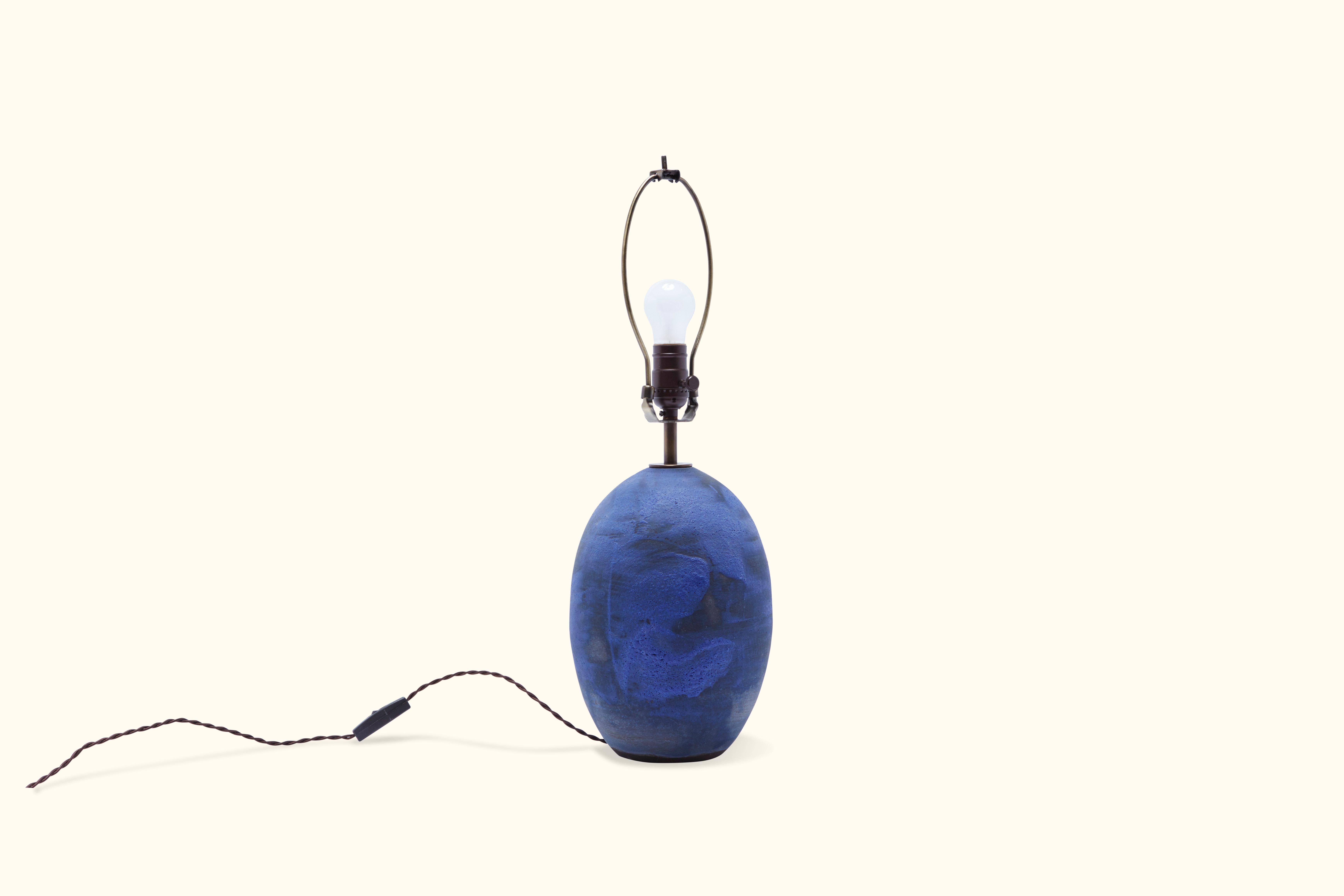 Ceramic egg-shaped lamp with matte blue and black glaze handmade in Los Angeles by Victoria Morris.