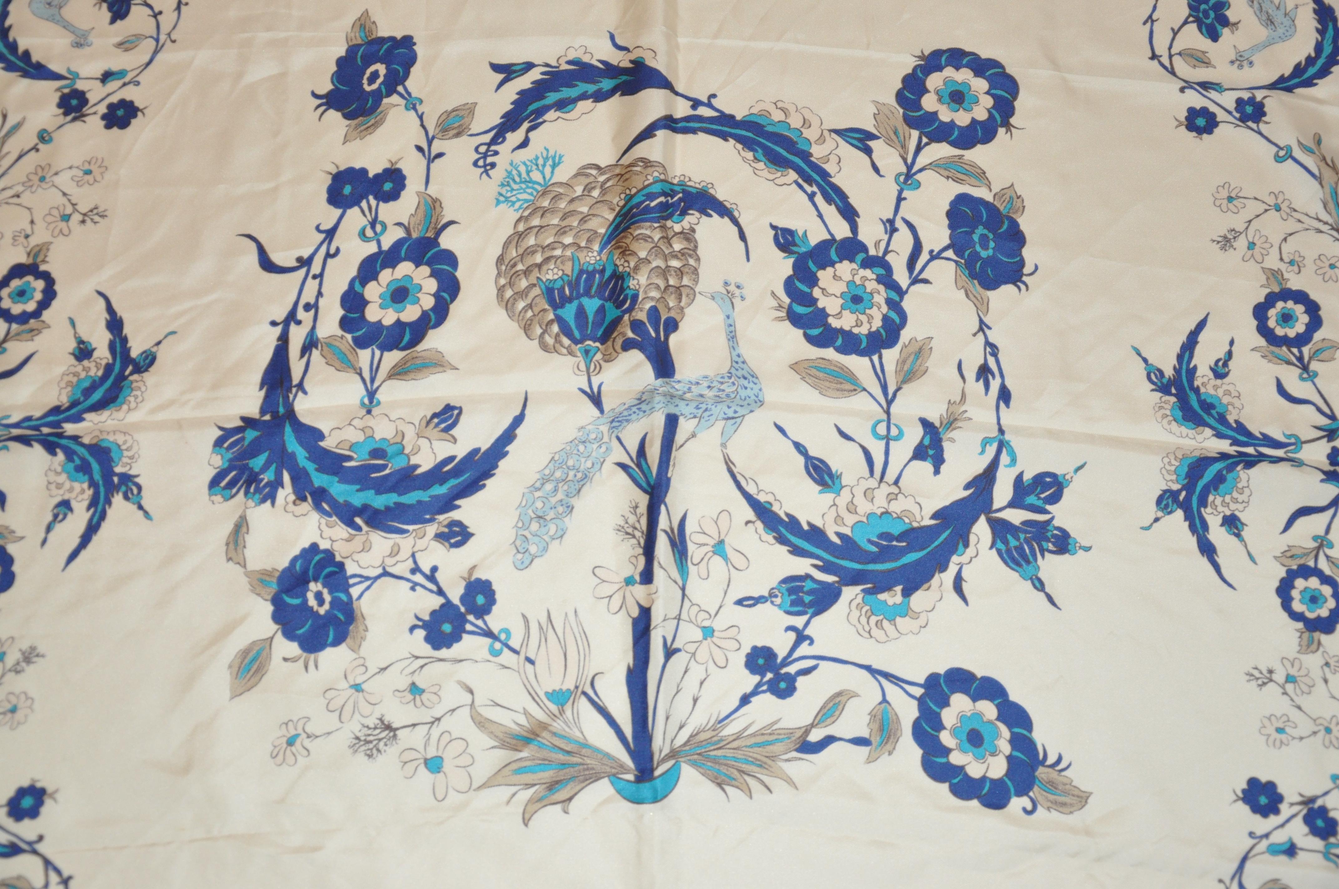       This wonderful elegant silk scarf with blue borders 