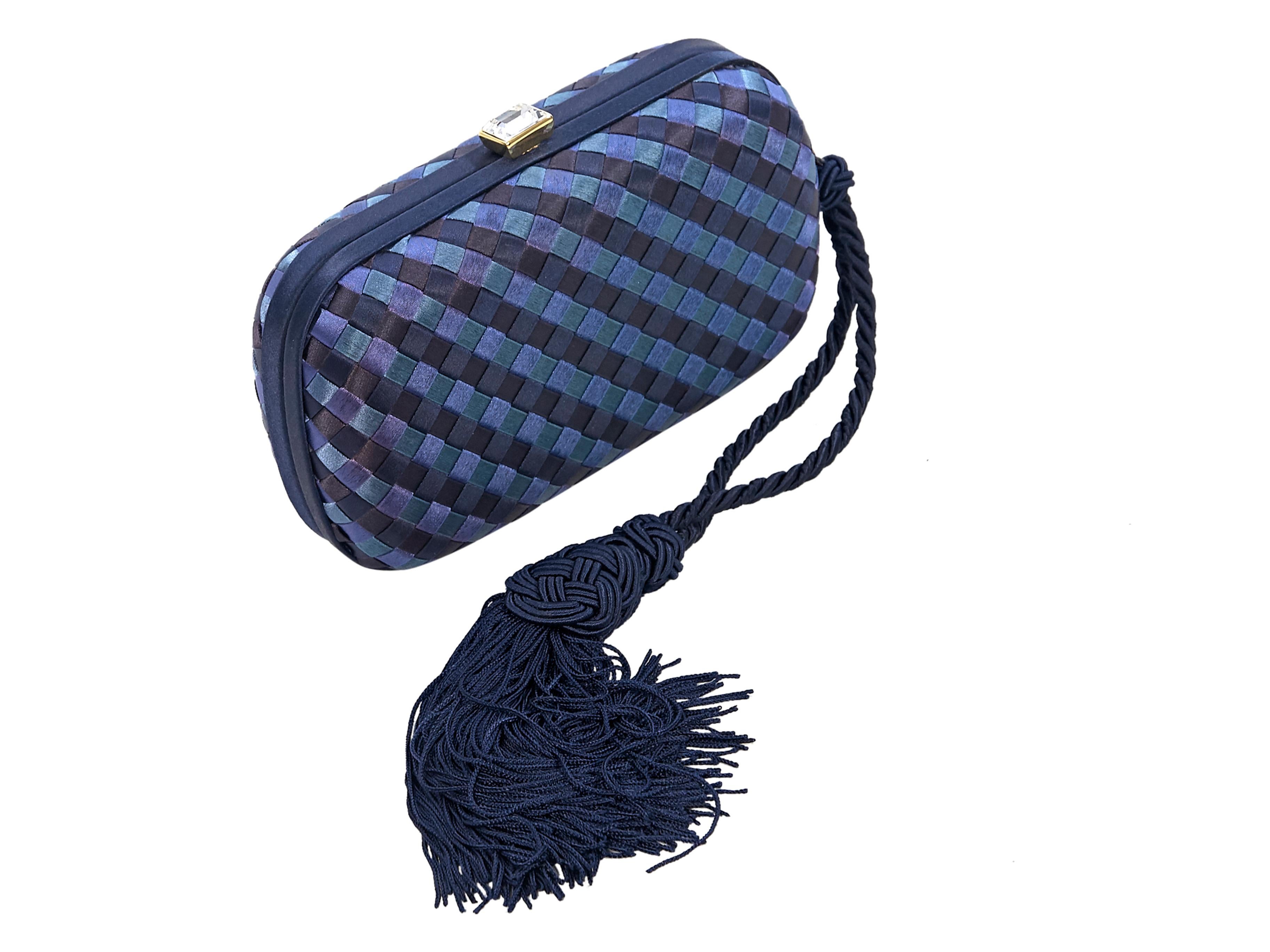 Product details:  Blue intrecciato satin clutch by Bottega Veneta.  Top faceted crystal push-lock closure.  Lined interior.  Side tassel accent.  Goldtone hardware.  Dust bag included.  7