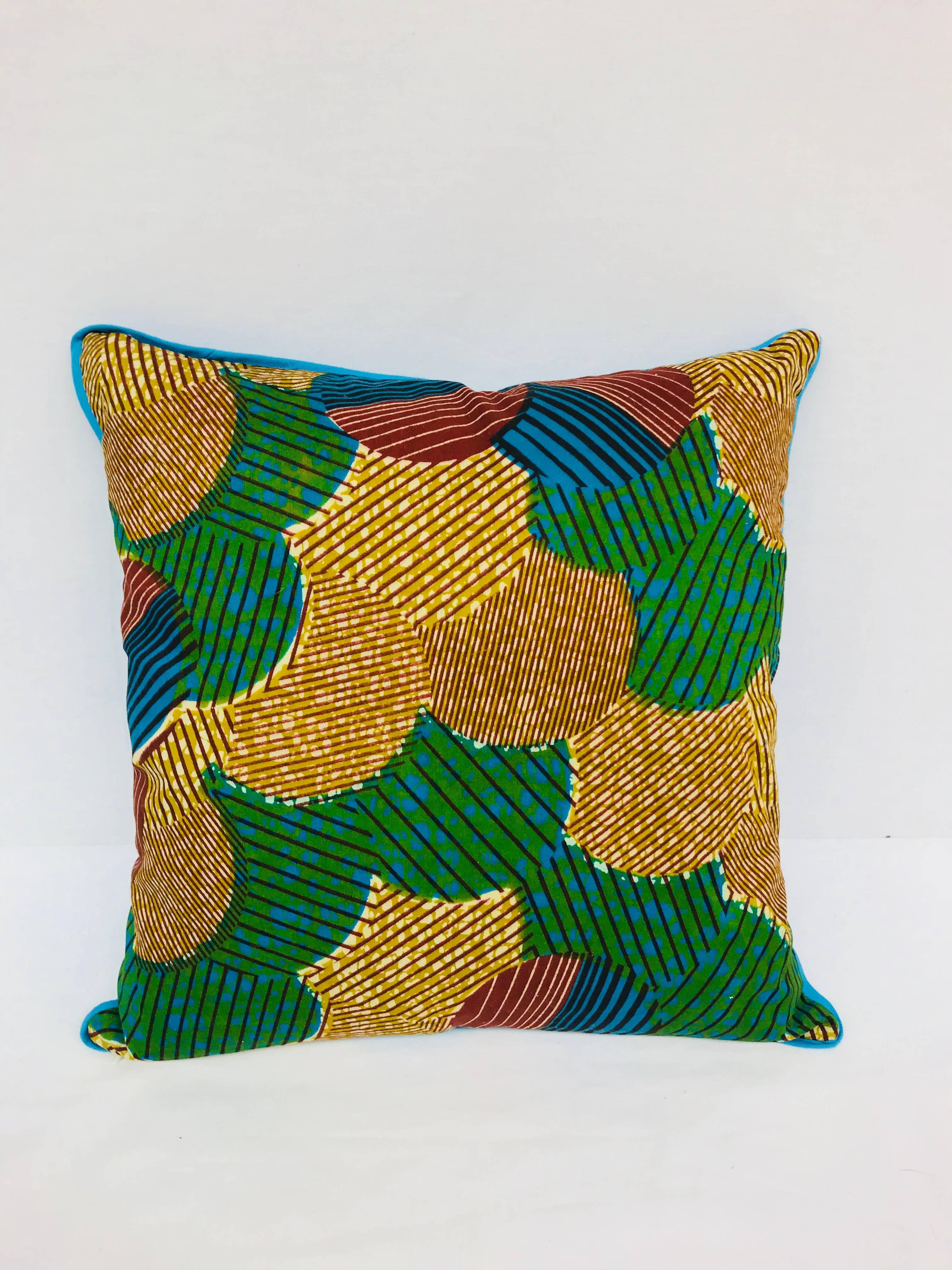 Crafted exclusively for Madcap Cottage in the USA, this African wax print pillow will bring a big dollop of delicious to a neutral sofa, bed, or chair. Back in a kicky blue hue. Hidden zipper. Made from Vlisco authentic Dutch Wax fabrics. Down