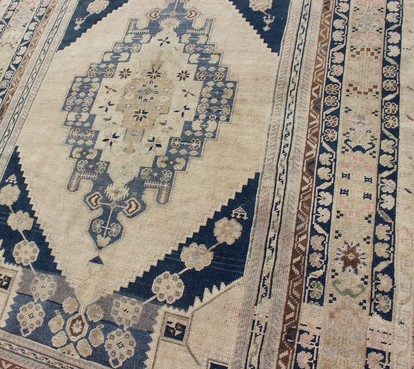 20th Century Blue, Brown, and Cream Turkish Oushak Rug Vintage with Medallion Design For Sale
