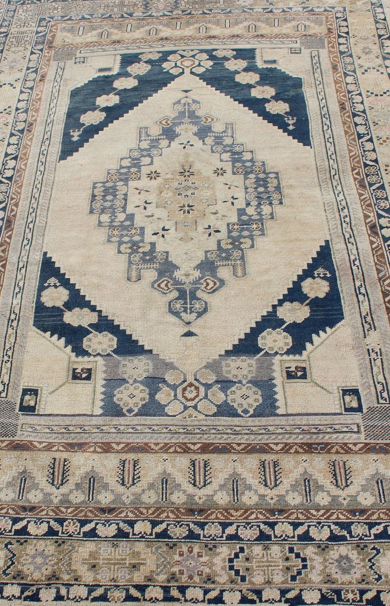 Wool Blue, Brown, and Cream Turkish Oushak Rug Vintage with Medallion Design For Sale
