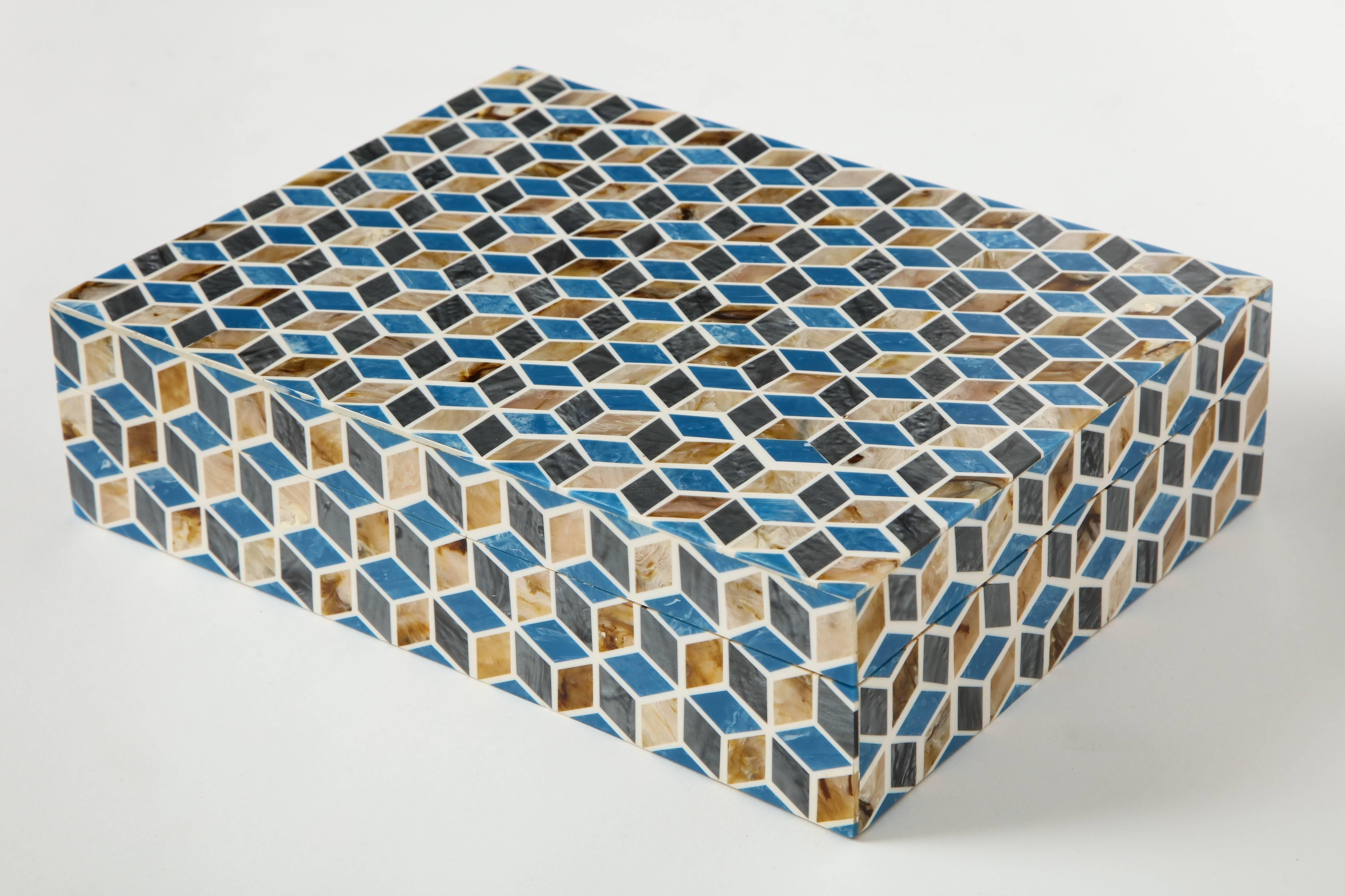 Bone geometric Inlay box featuring a wood lined interior and blue, brown and sand colored tiles.