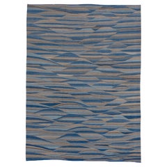 Tapis moderne en laine bleu et marron à tissage plat