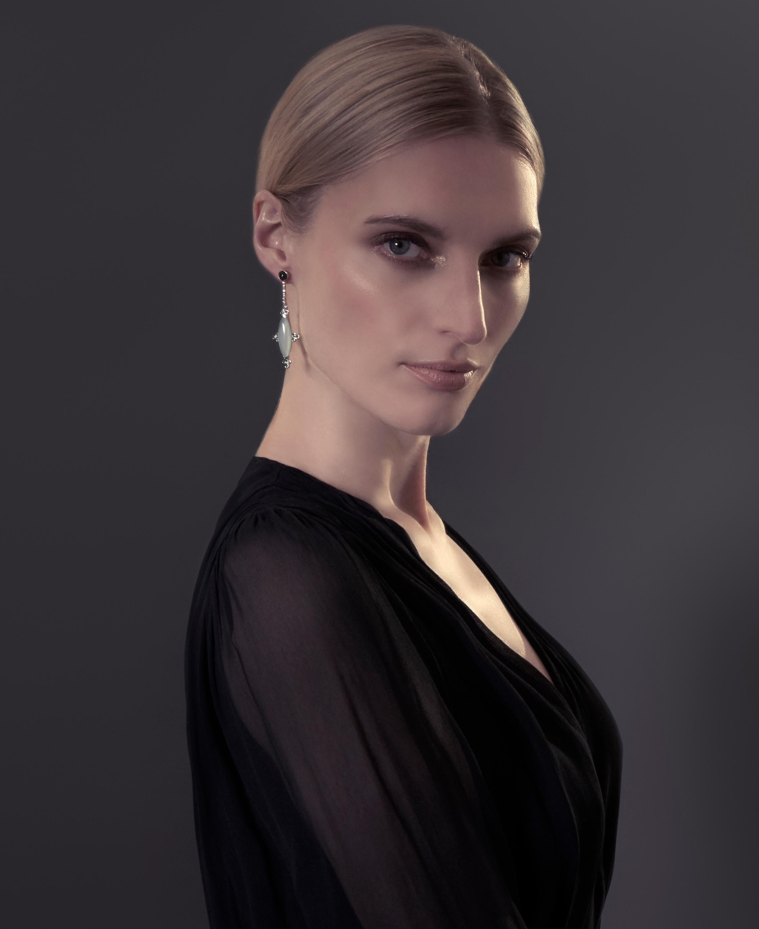 Ornate details and colorful gems create a stunning display of artistry in Ri Noor's Blue Calcedony with Tsavorite and Diamond Earrings. The earrings mix shapes and materials in a unique way which makes a special statement that elevates any outfit,