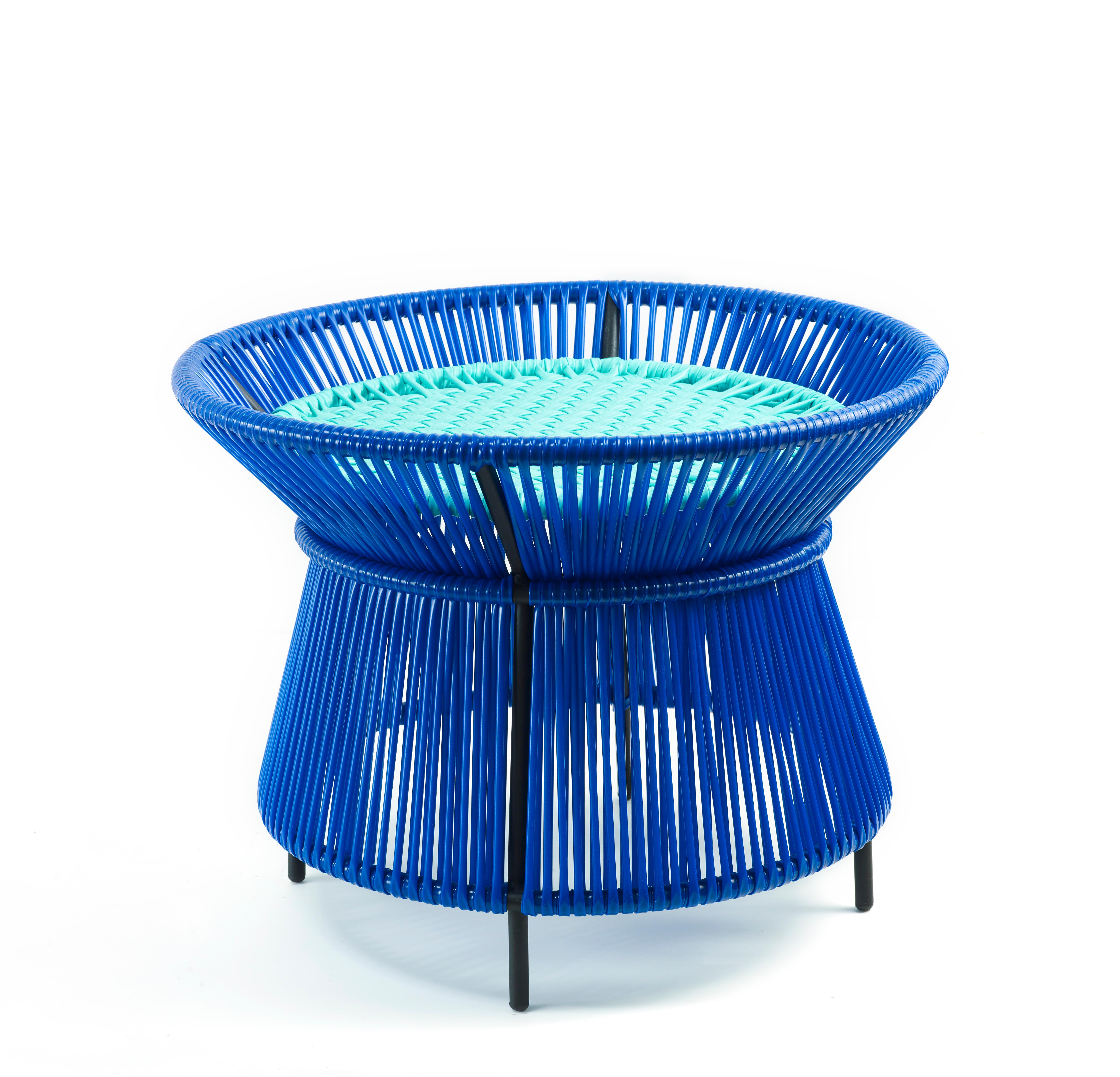 Blue Caribe basket table by Sebastian Herkner
Materials: Galvanized and powder-coated tubular steel. PVC strings are made from recycled plastic.
Technique: Made from recycled plastic and weaved by local craftspeople in Colombia. 
Dimensions: