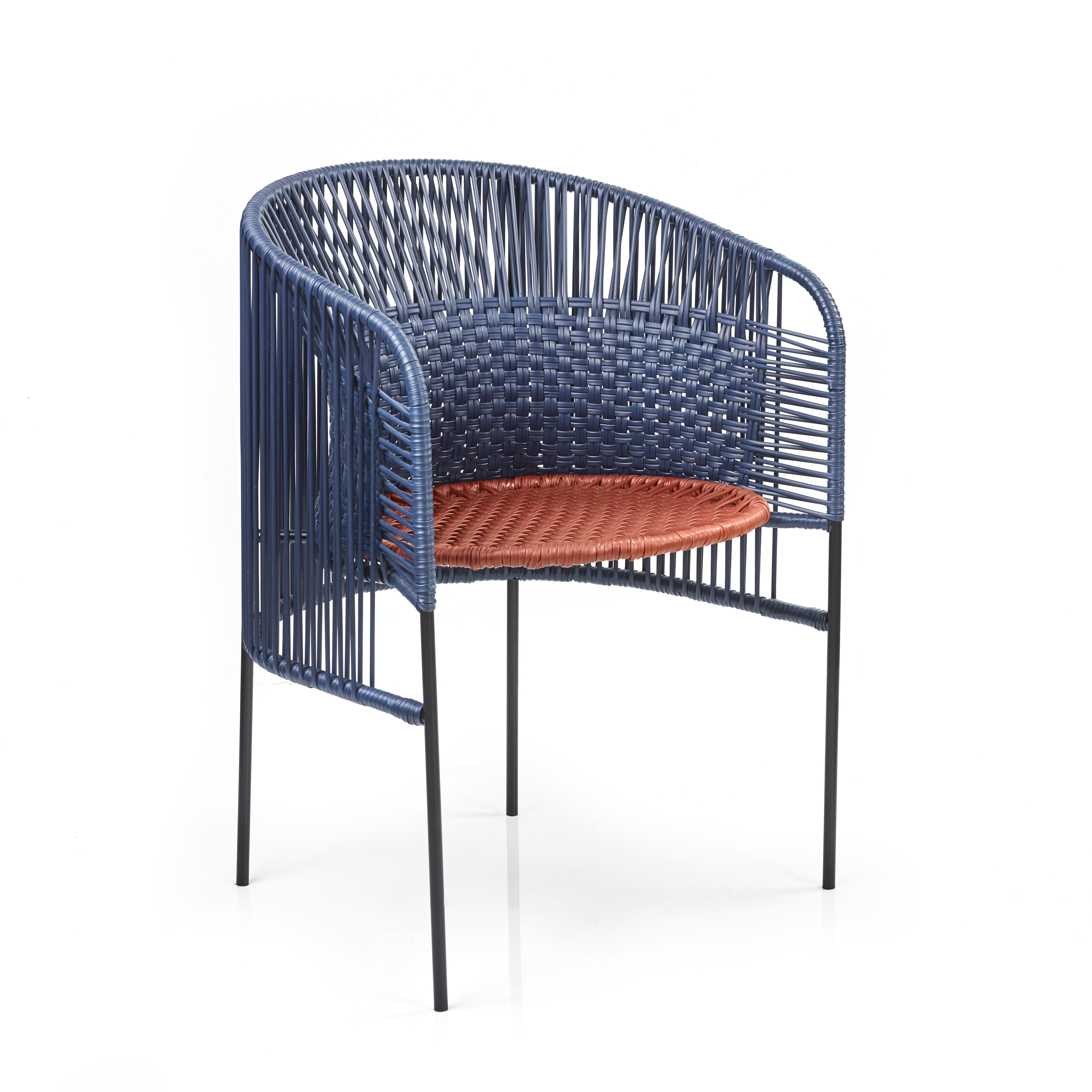 Blue caribe chic dining chair by Sebastian Herkner
Materials: Galvanized and powder-coated tubular steel. PVC strings are made from recycled plastic.
Technique: Made from recycled plastic and weaved by local craftspeople in Colombia. 
Dimensions: