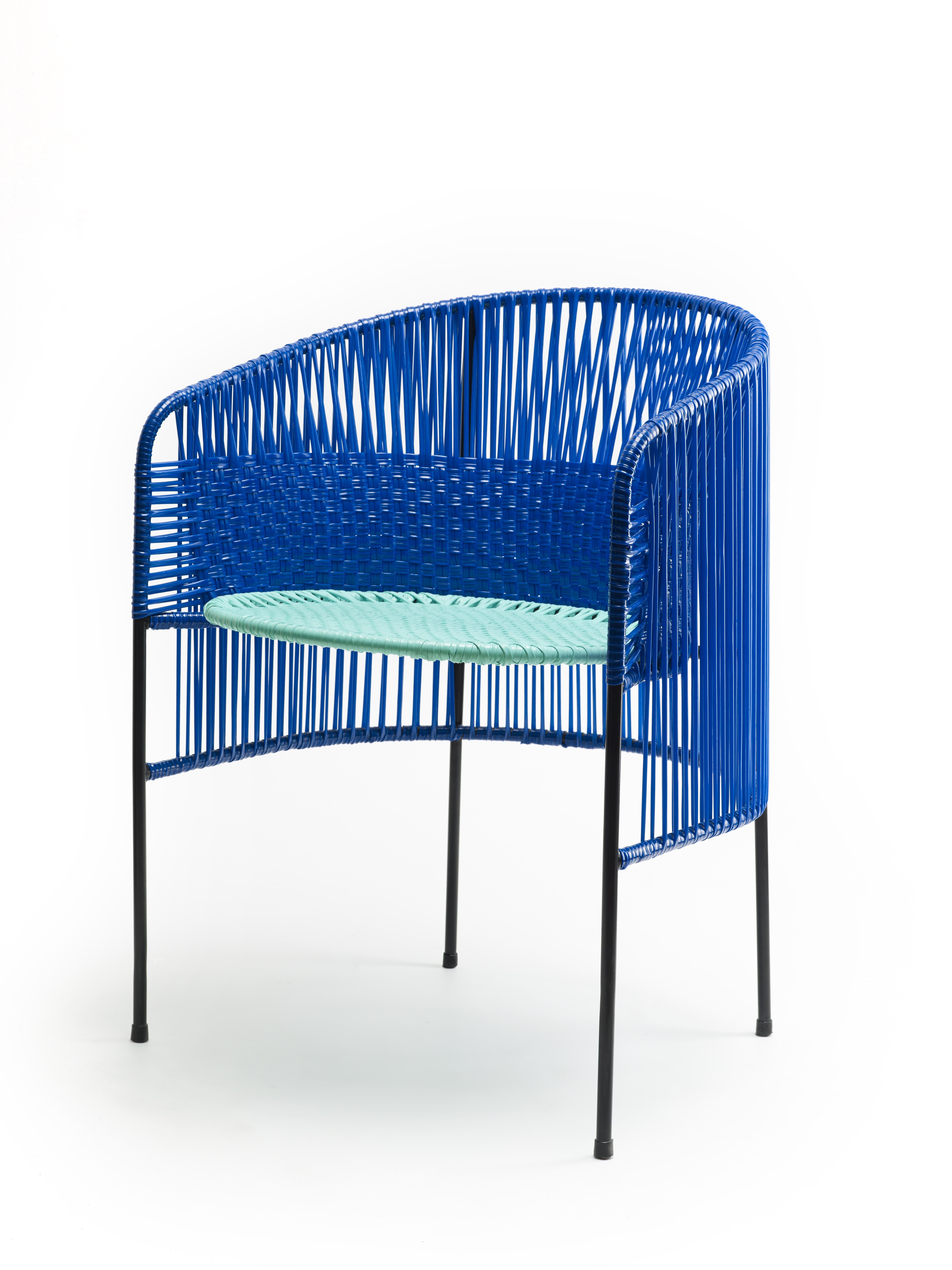Blue Caribe lounge chair by Sebastian Herkner
Materials: Galvanized and powder-coated tubular steel. PVC strings are made from recycled plastic.
Technique: Made from recycled plastic and weaved by local craftspeople in Colombia. 
Dimensions: W