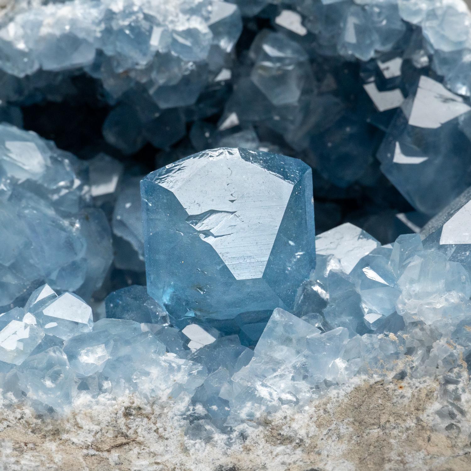 This unique Madagascan Blue Celestite Cluster exhibits large, gem crystals of remarkable quality, featuring prism faces and sharp chisel-terminations - surpassing the average blue-grey grains from the region. All shiny crystals are glassy and boast